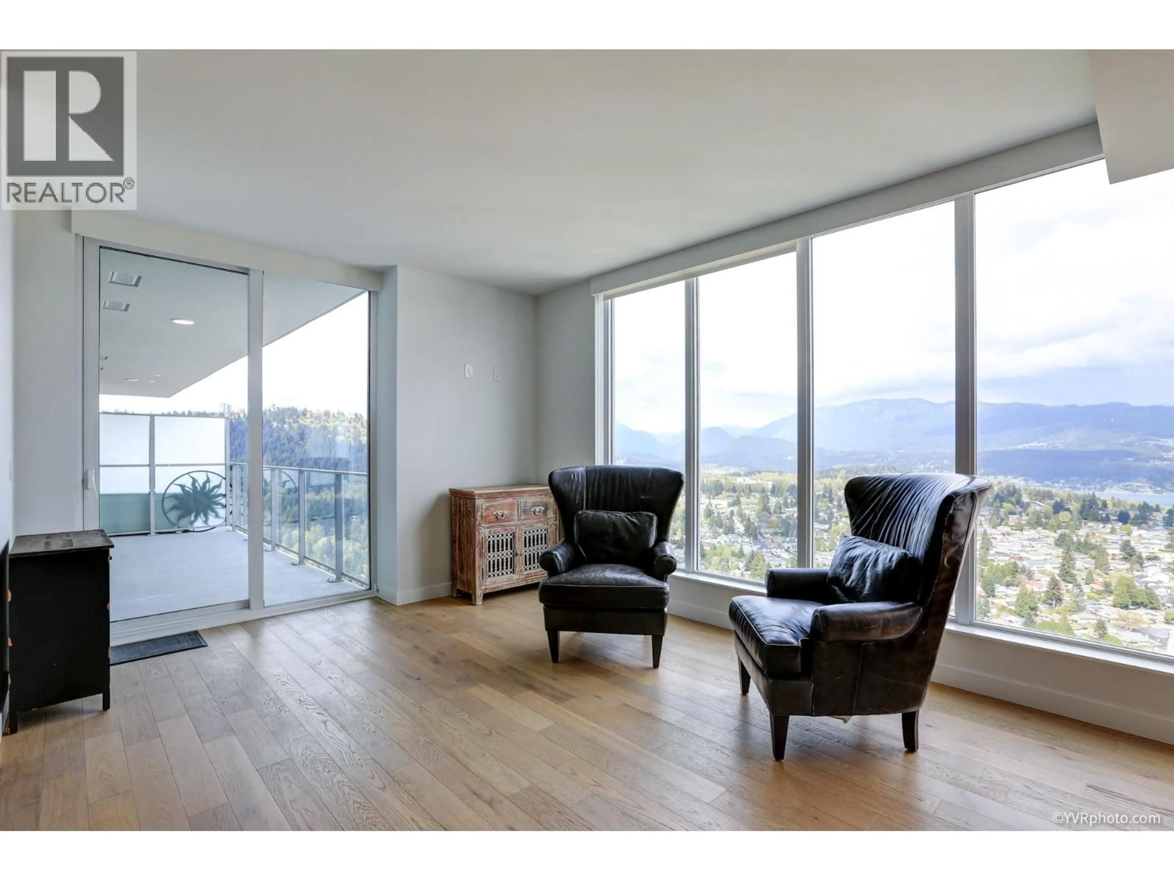 Living room with furniture, wood/laminate floor for 4603 - 567 CLARKE ROAD, Coquitlam British Columbia V3J0K7