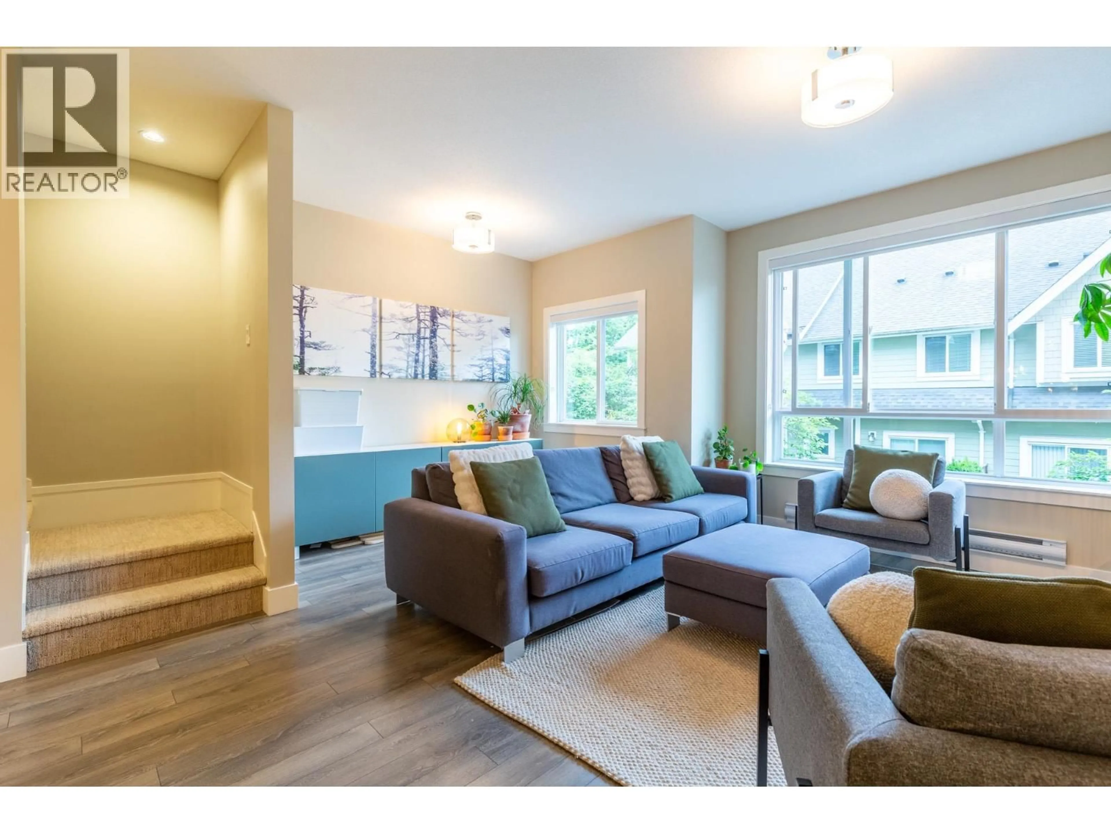 Living room with furniture, wood/laminate floor for 104 - 1405 DAYTON STREET, Coquitlam British Columbia V3E0L4