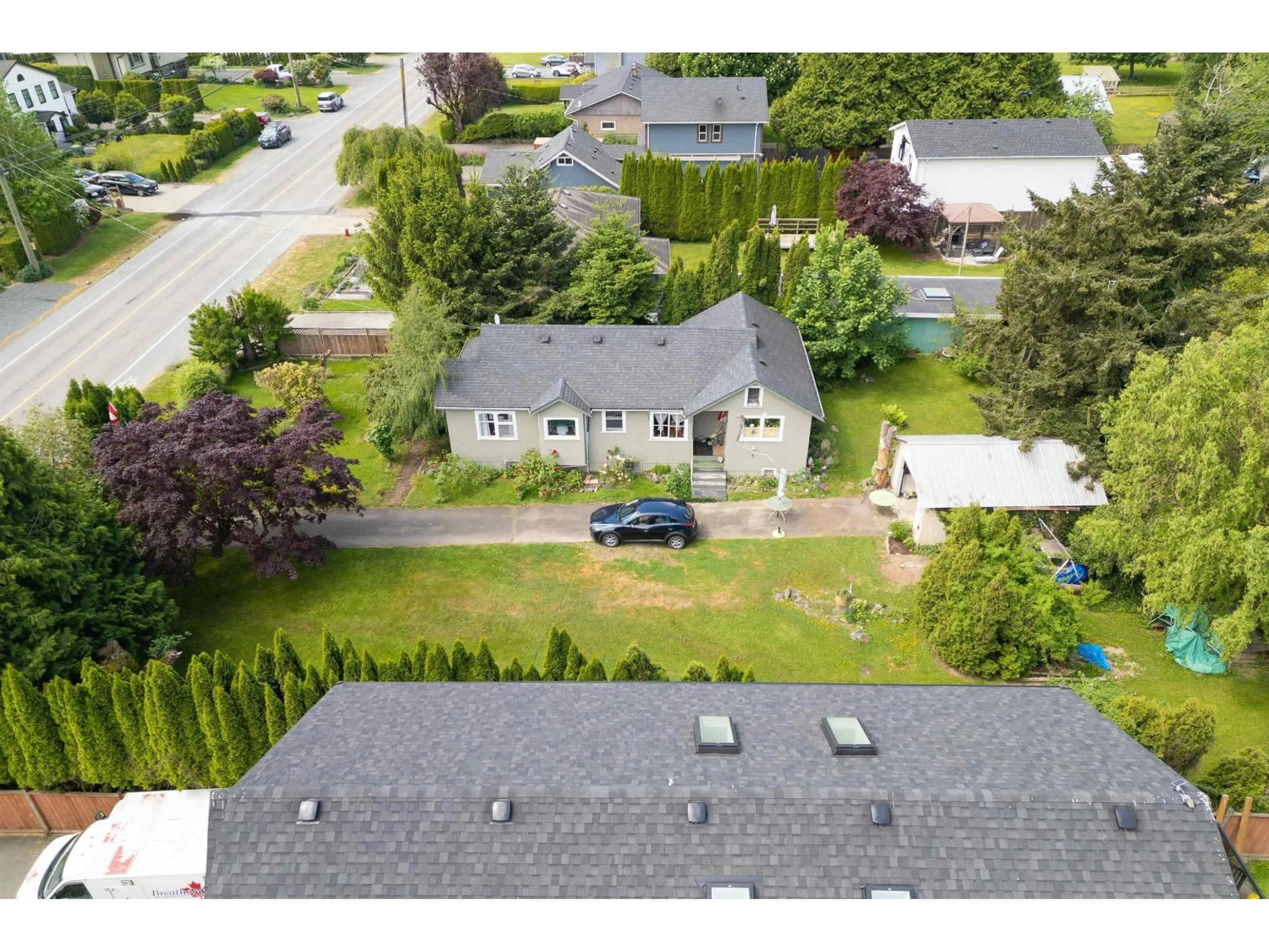 A pic from outside/outdoor area/front of a property/back of a property/a pic from drone, street for 41793 YARROW CENTRAL ROAD, Yarrow British Columbia V2R5G3
