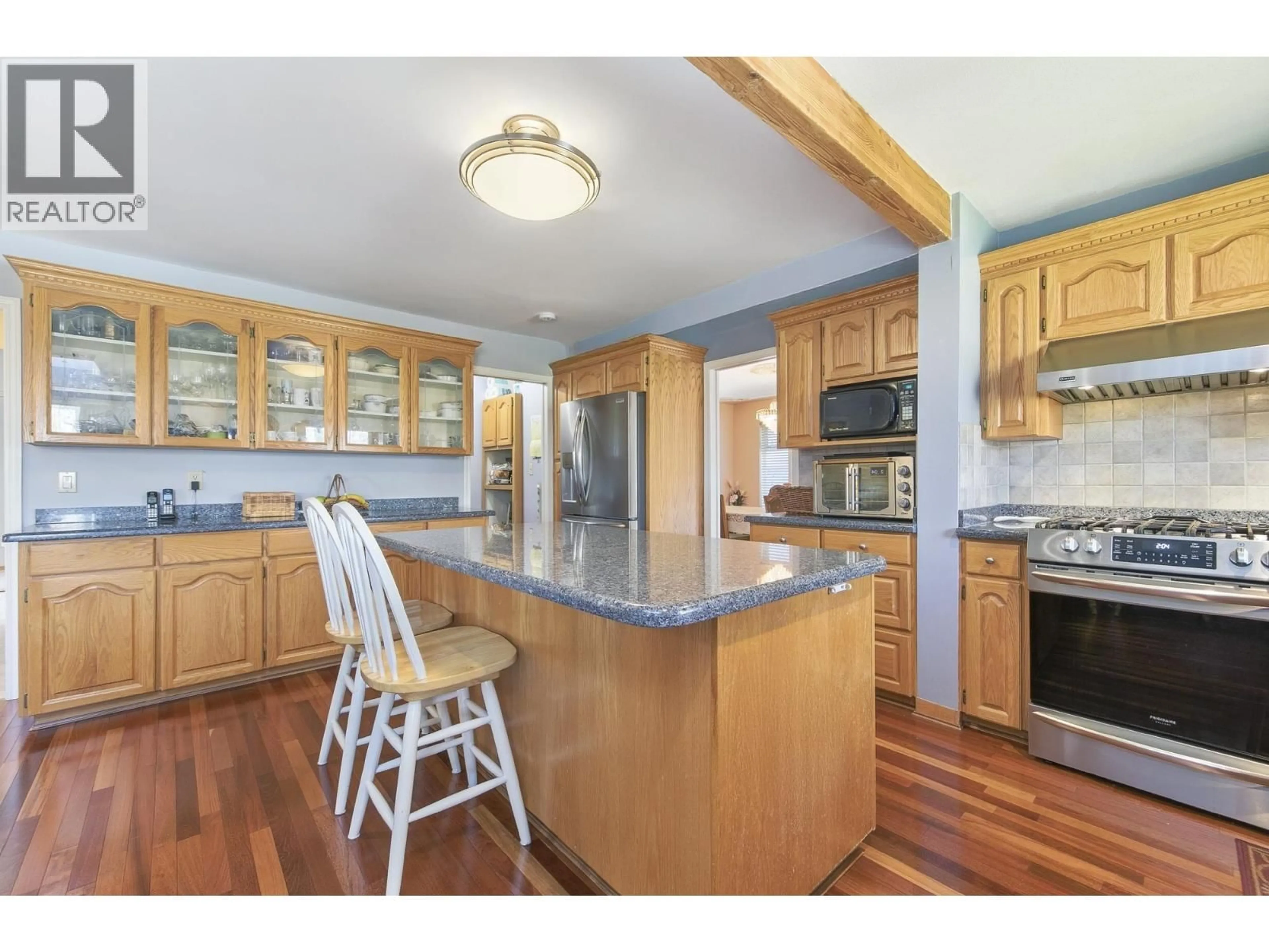 Open concept kitchen, wood/laminate floor for 4657 GRASSMERE STREET, Burnaby British Columbia V5G2N8