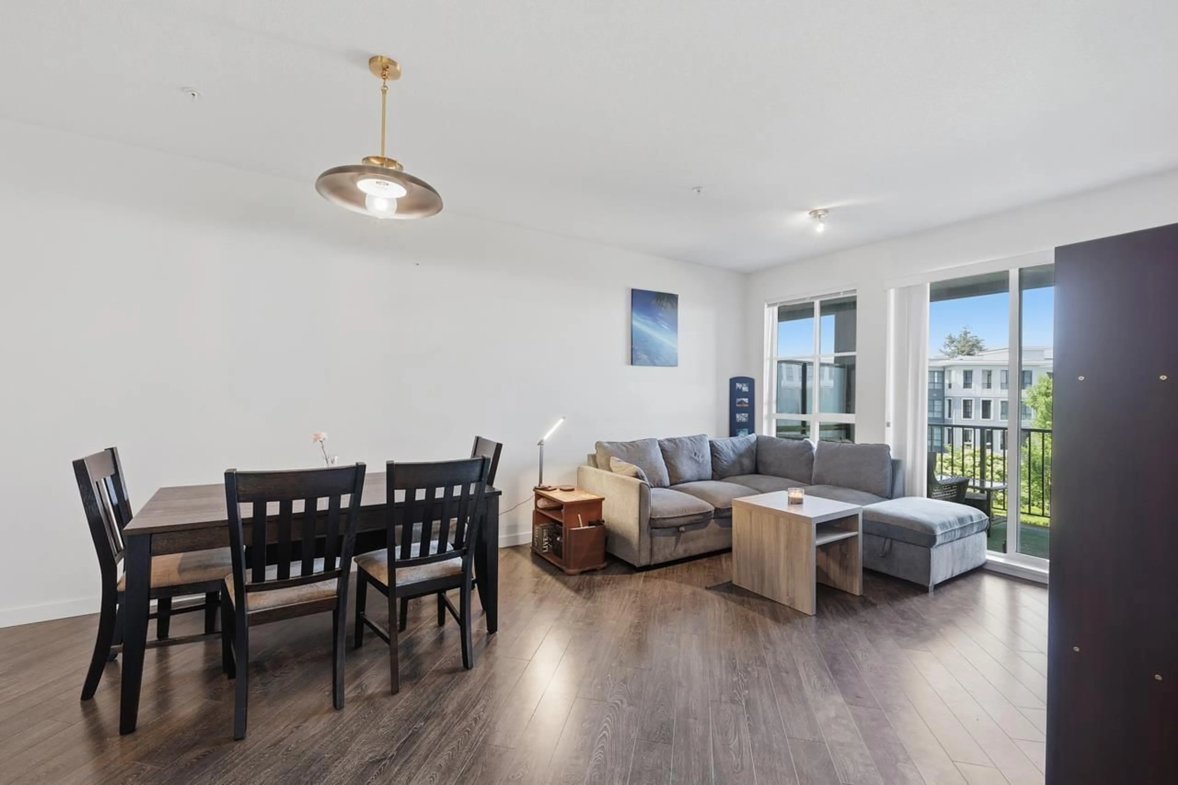 Living room with furniture, wood/laminate floor for 304 - 15137 33 AVENUE, Surrey British Columbia V3Z0Y1