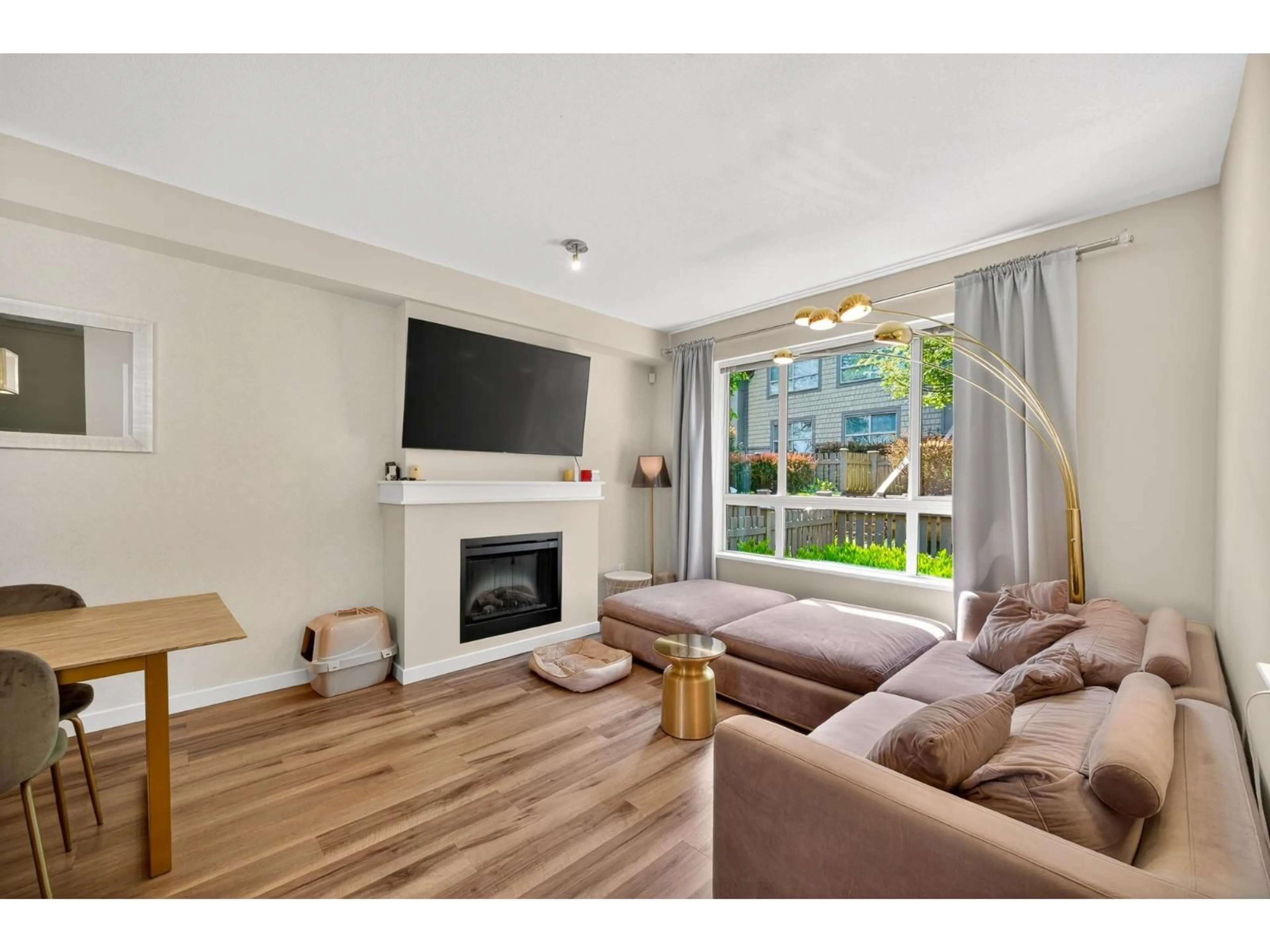 Living room with furniture, wood/laminate floor for 96 - 2738 158 STREET, Surrey British Columbia V3Z3K3