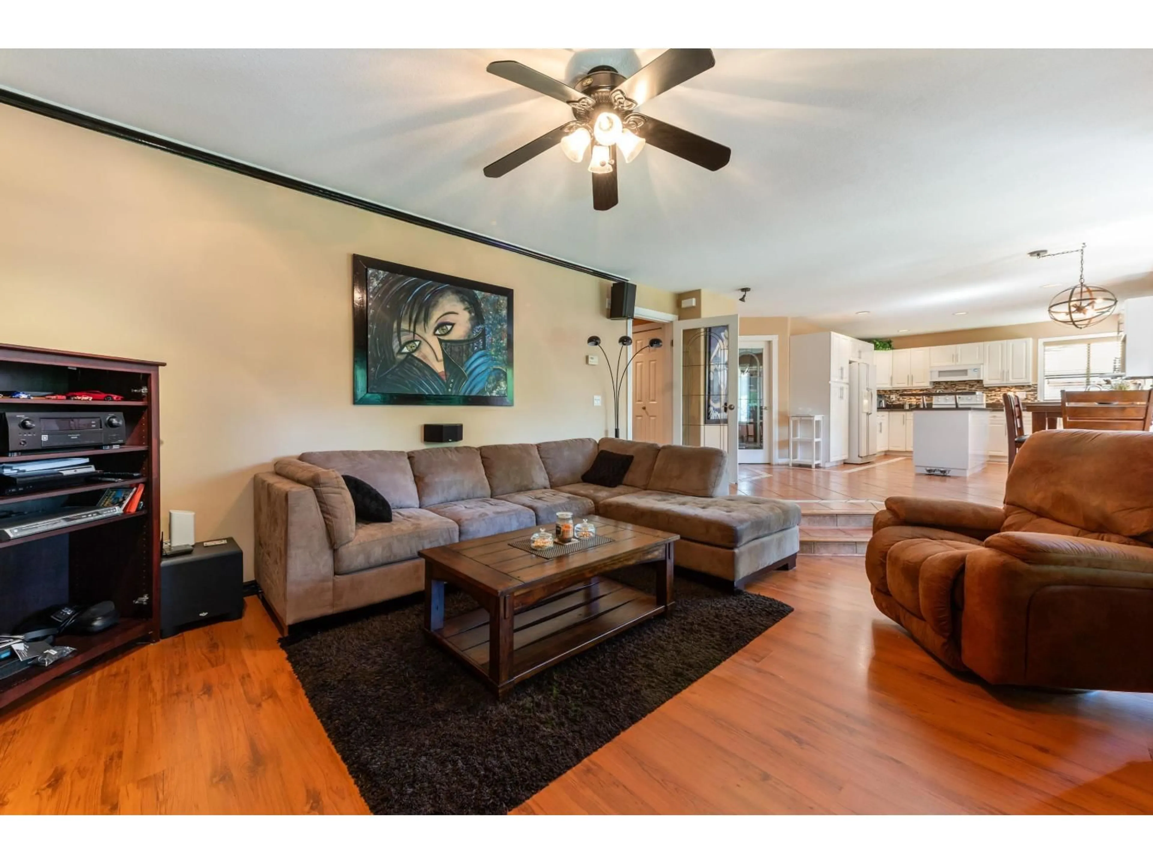 Living room with furniture, wood/laminate floor for 8588 141 STREET, Surrey British Columbia V3W3A9