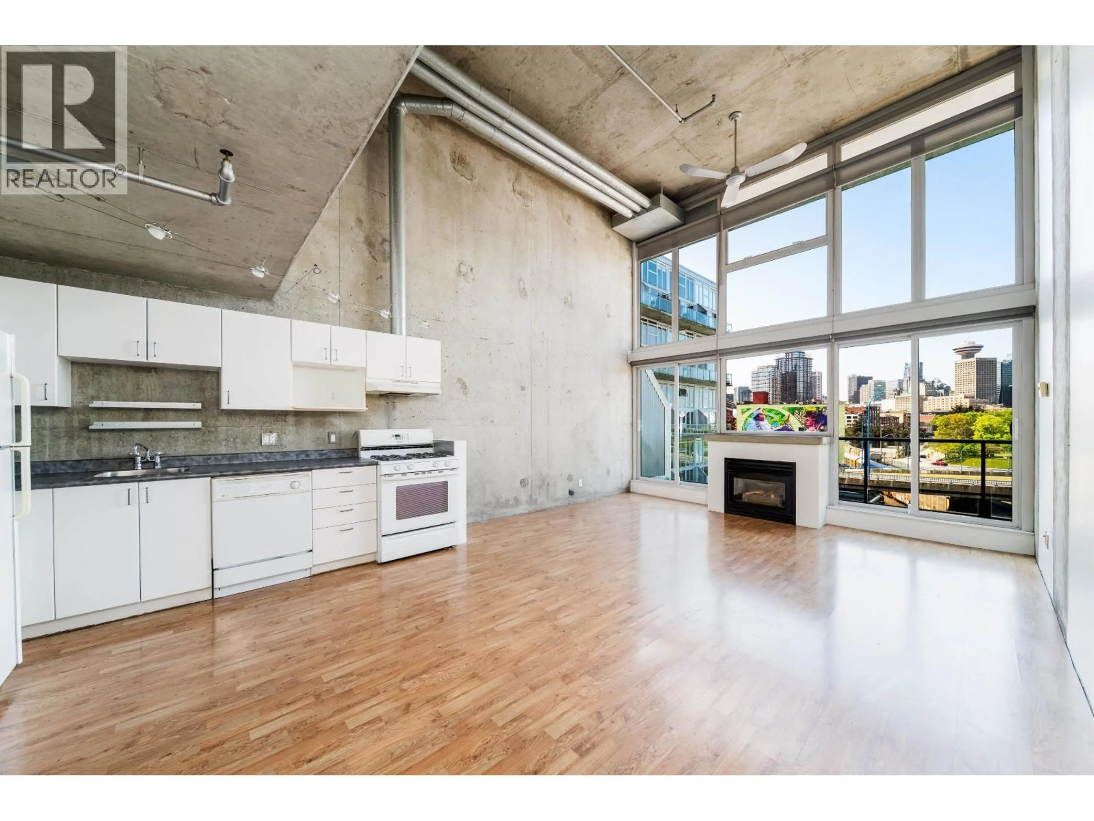 Open concept kitchen, cement floor for 431 - 289 ALEXANDER STREET, Vancouver British Columbia V6A4H6