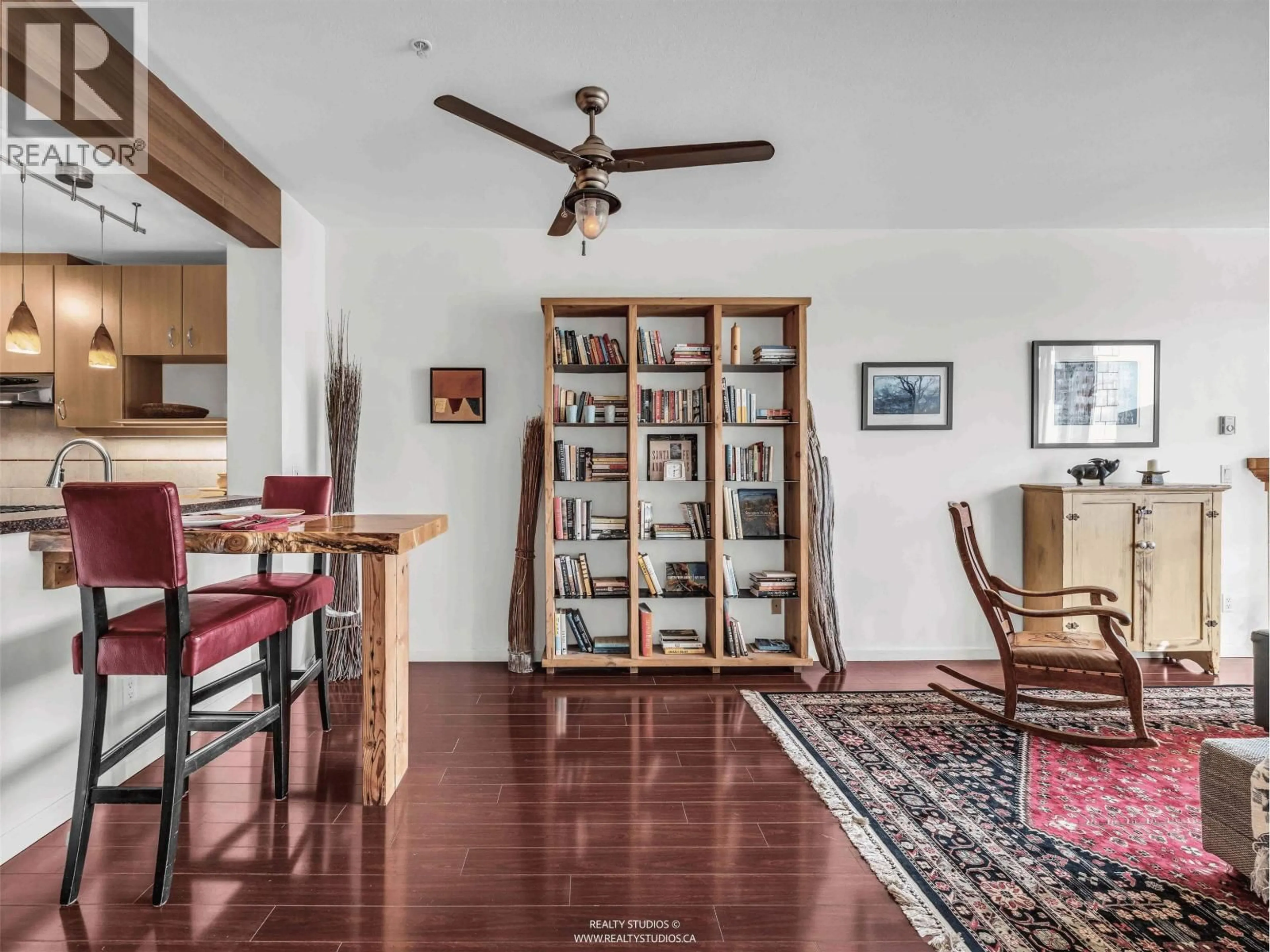 Living room with furniture, wood/laminate floor for 417 - 580 RAVEN WOODS DRIVE, North Vancouver British Columbia V7G2T2