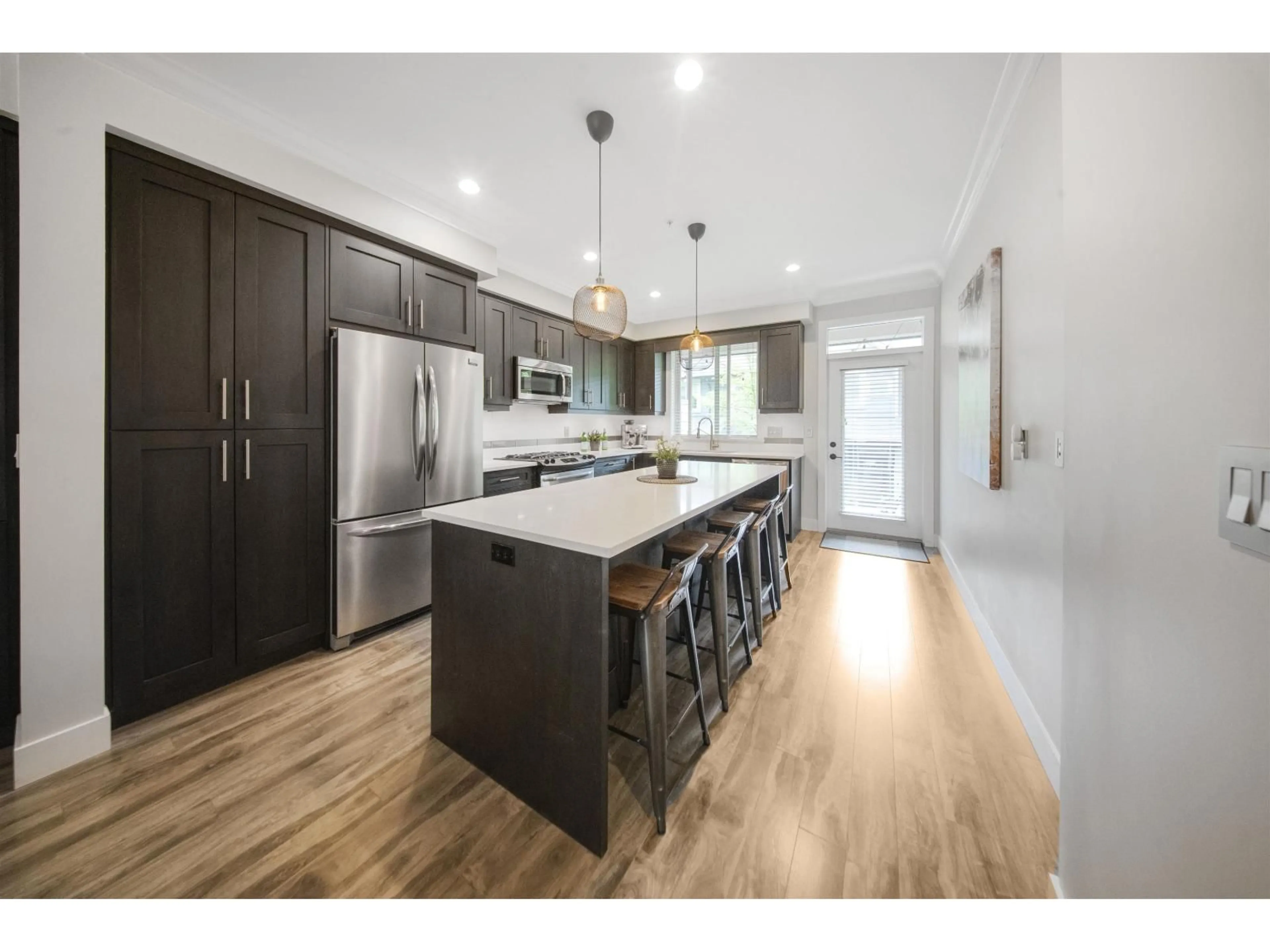Open concept kitchen, wood/laminate floor for 39 - 19913 70 AVENUE, Langley British Columbia V2Y0S9