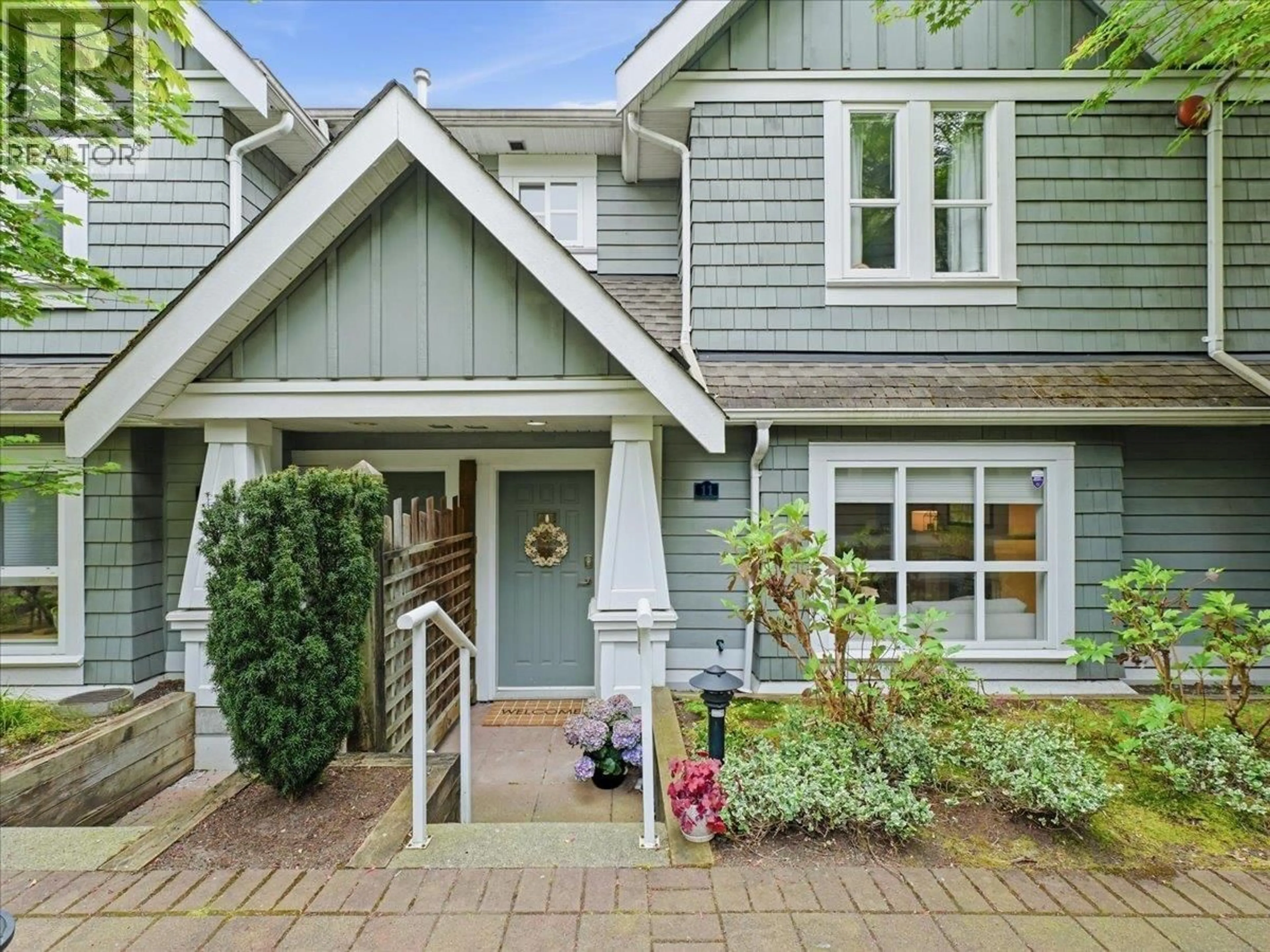 Home with vinyl exterior material, street for 11 - 2688 MOUNTAIN HIGHWAY, North Vancouver British Columbia V7J2N5