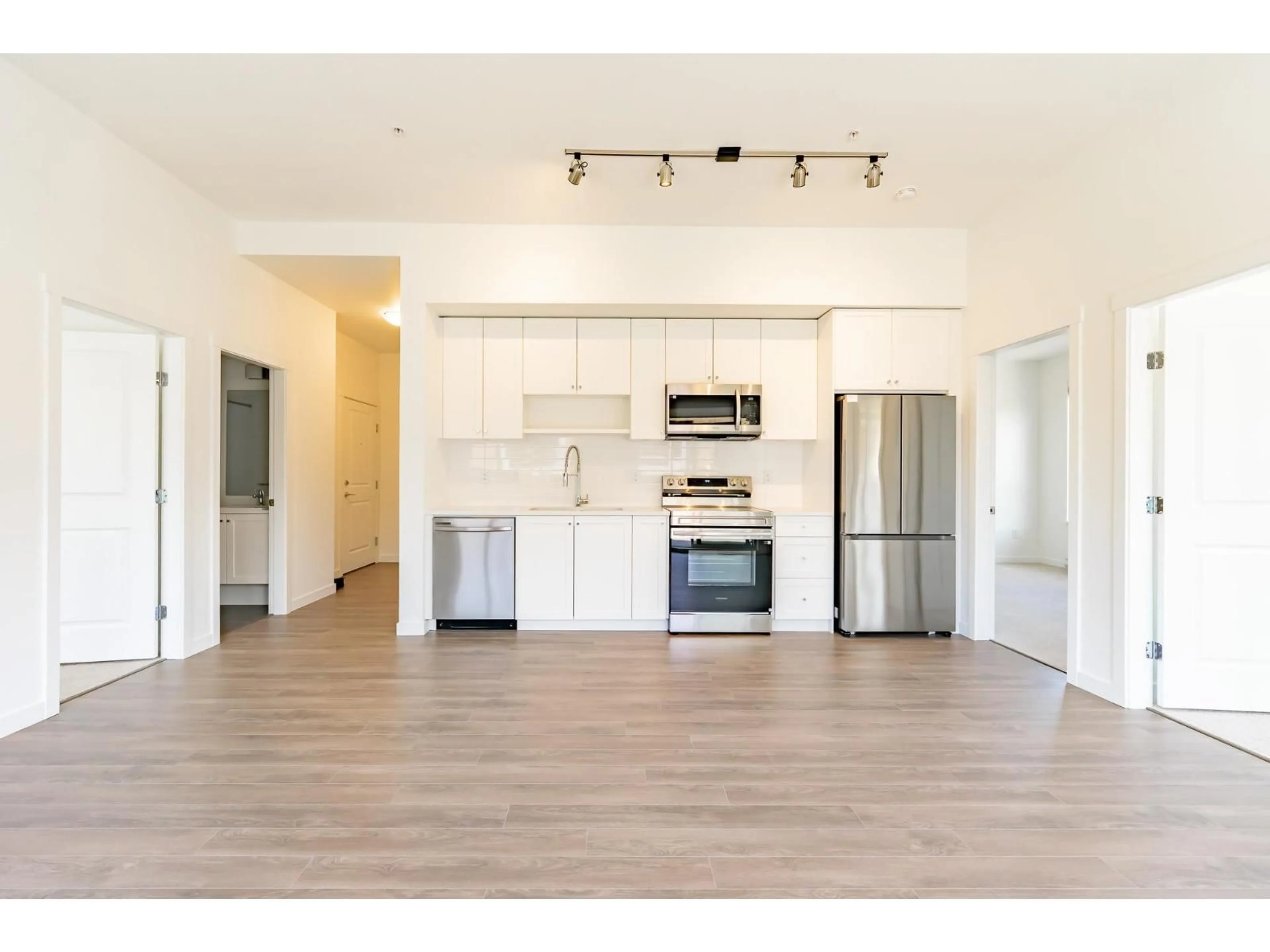 Open concept kitchen, wood/laminate floor for 607 - 15735 85 AVENUE, Surrey British Columbia V4N6Z1