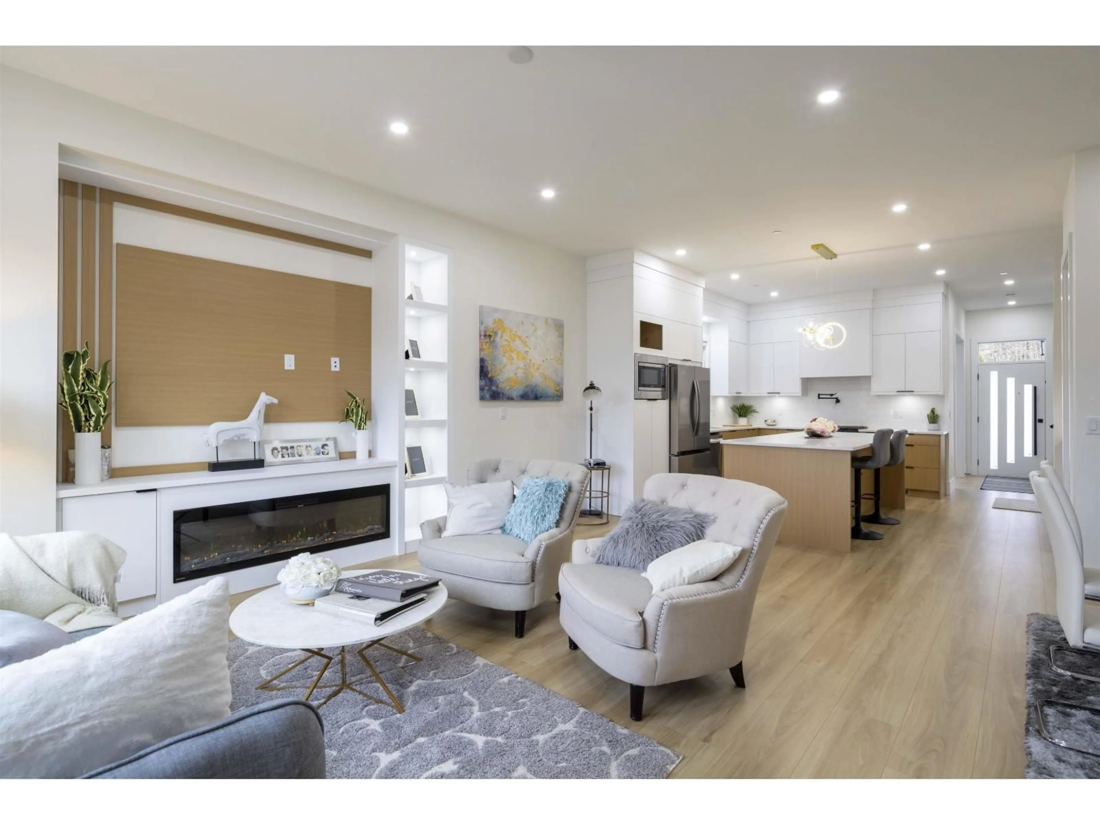Living room with furniture, wood/laminate floor for 7699 197 STREET, Langley British Columbia V2Y3T4