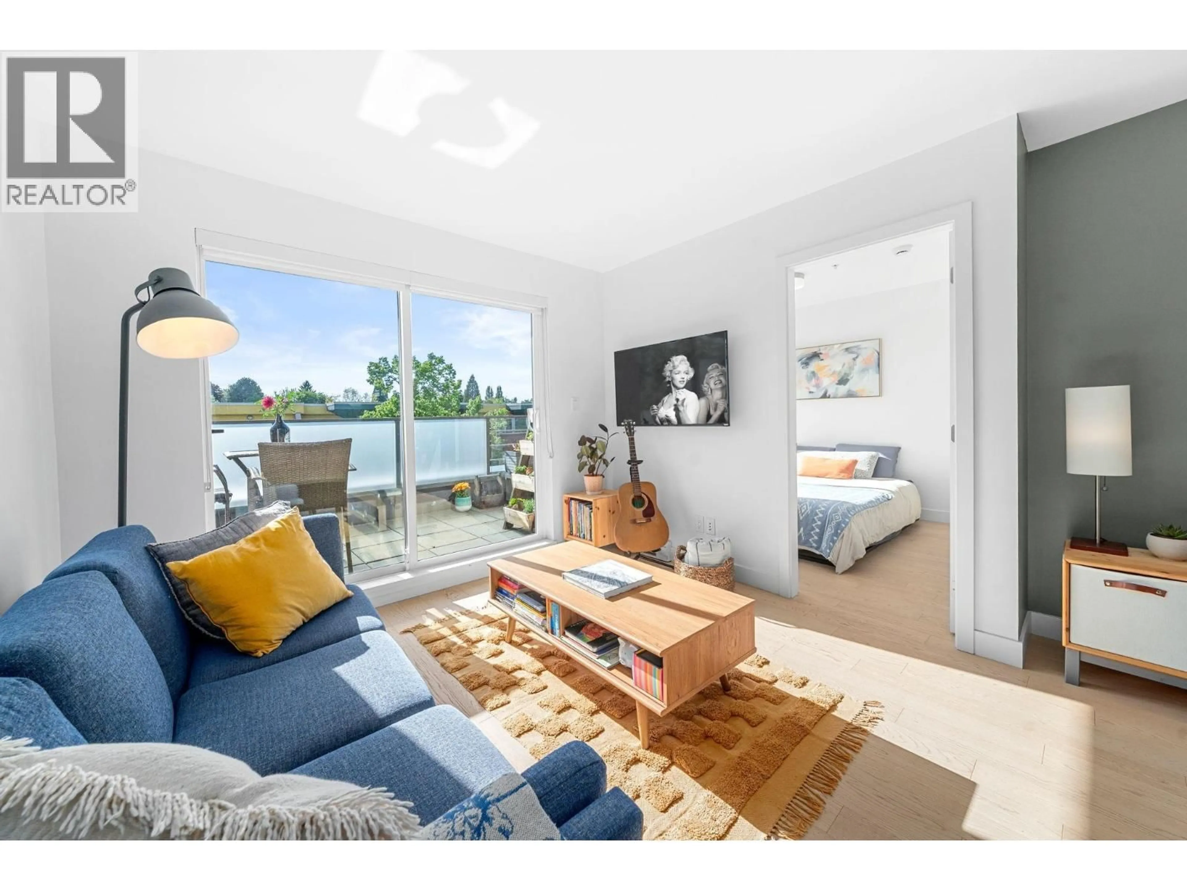 Living room with furniture, wood/laminate floor for 516 - 3456 COMMERCIAL STREET, Vancouver British Columbia V5N4E9