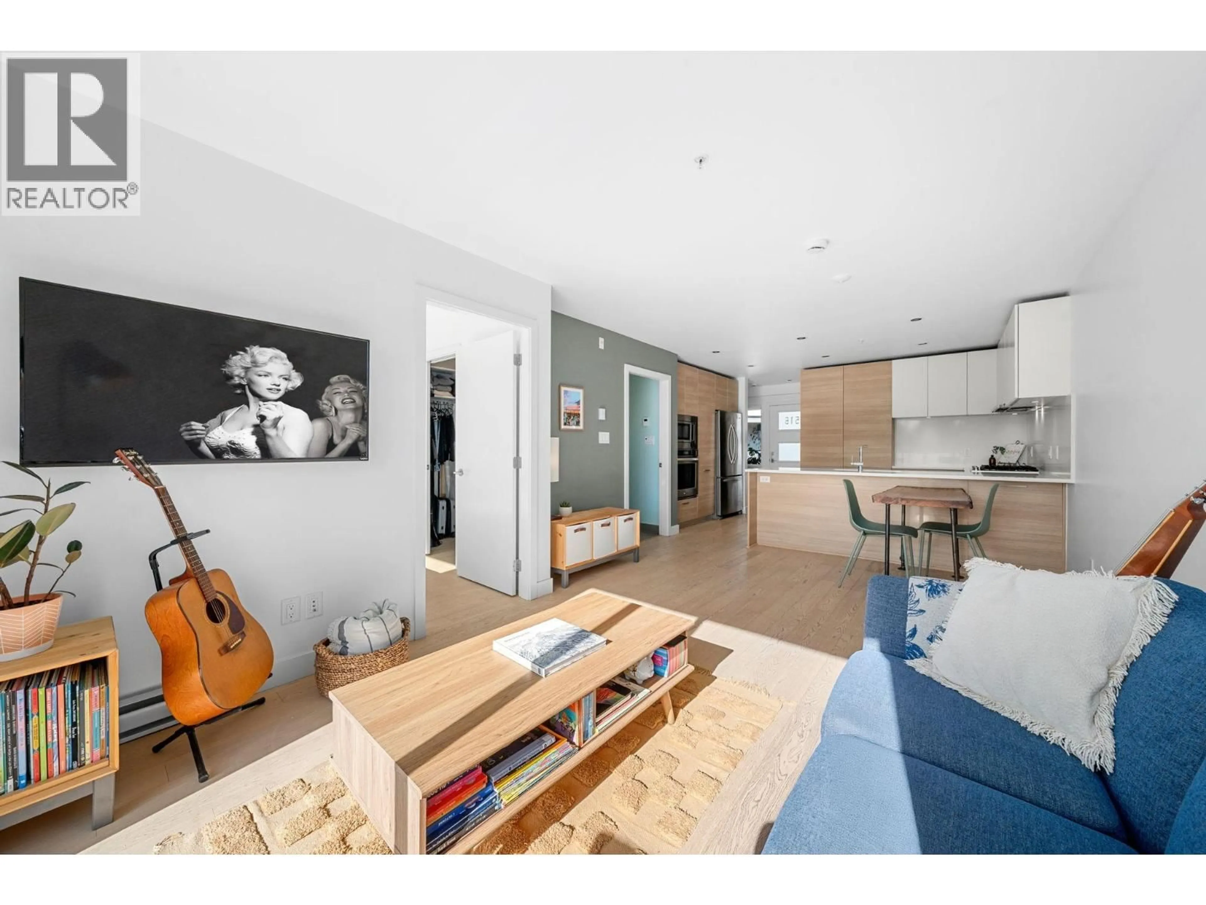 Open concept kitchen, wood/laminate floor for 516 - 3456 COMMERCIAL STREET, Vancouver British Columbia V5N4E9