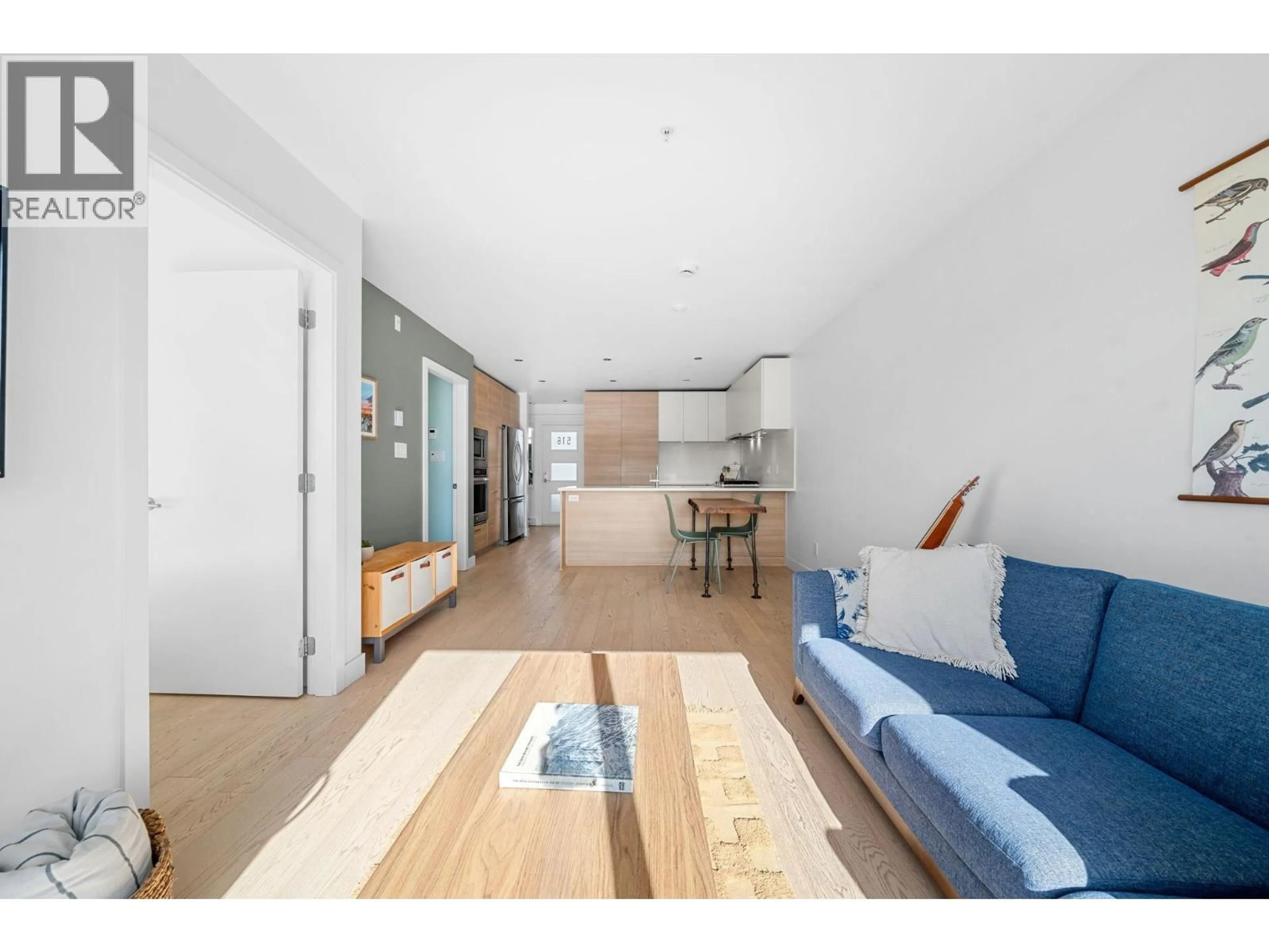 Living room with furniture, wood/laminate floor for 516 - 3456 COMMERCIAL STREET, Vancouver British Columbia V5N4E9