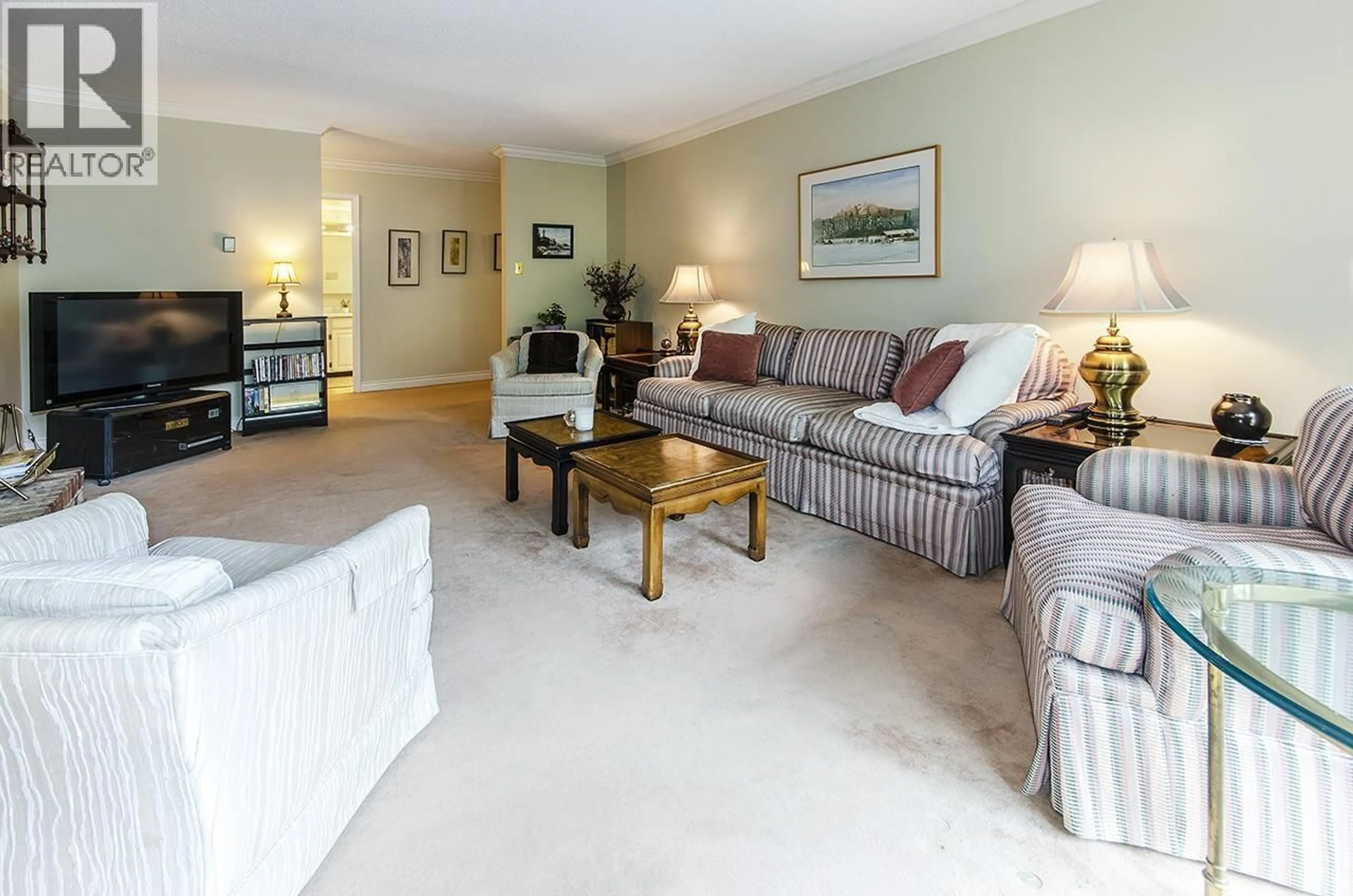 Living room with furniture, carpet floor for 309 - 1385 DRAYCOTT ROAD, North Vancouver British Columbia V7J3K9