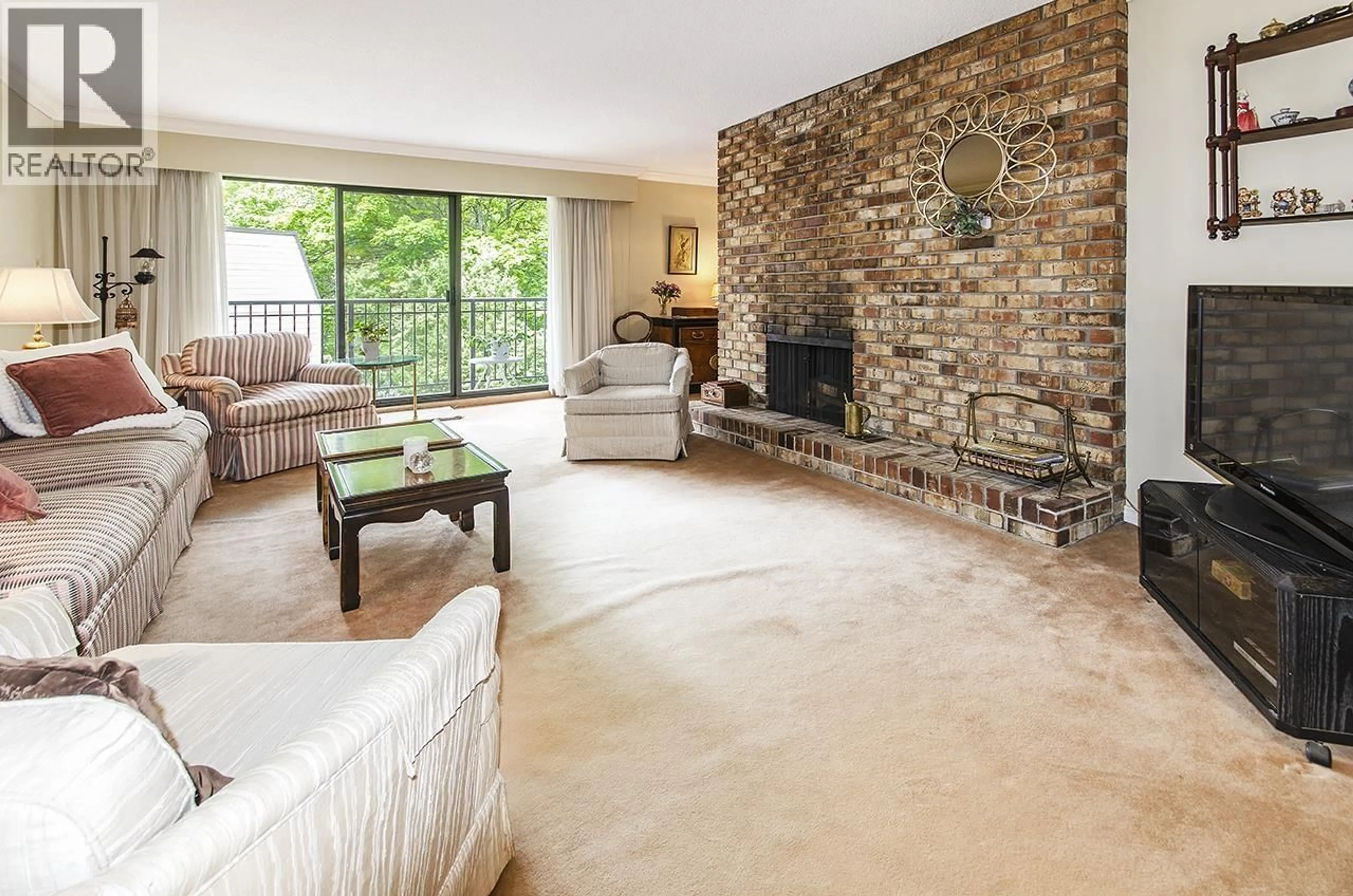 Living room with furniture, ceramic/tile floor for 309 - 1385 DRAYCOTT ROAD, North Vancouver British Columbia V7J3K9