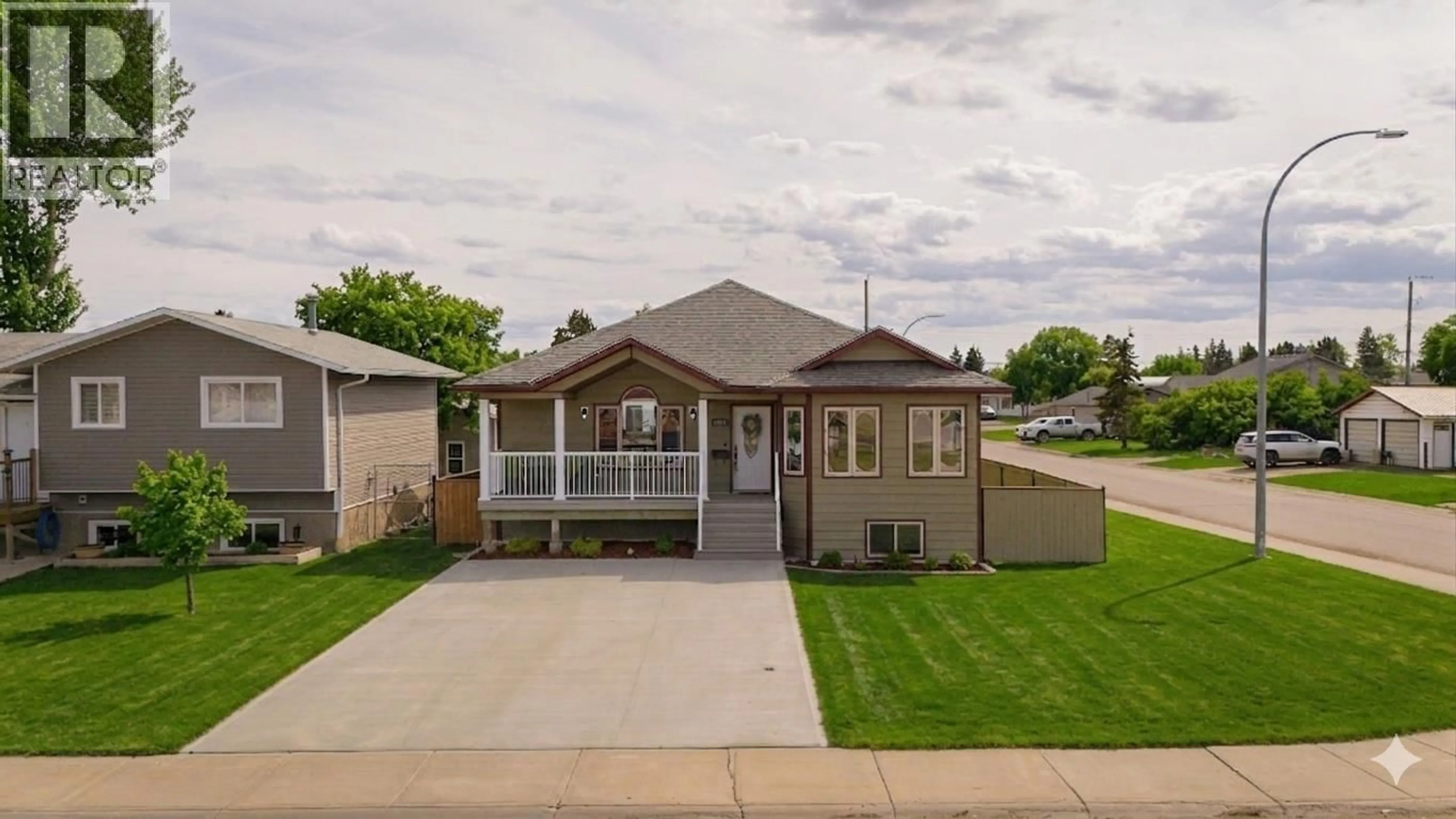 Home with vinyl exterior material, street for 8019 97 AVENUE, Fort St. John British Columbia V1J1L7