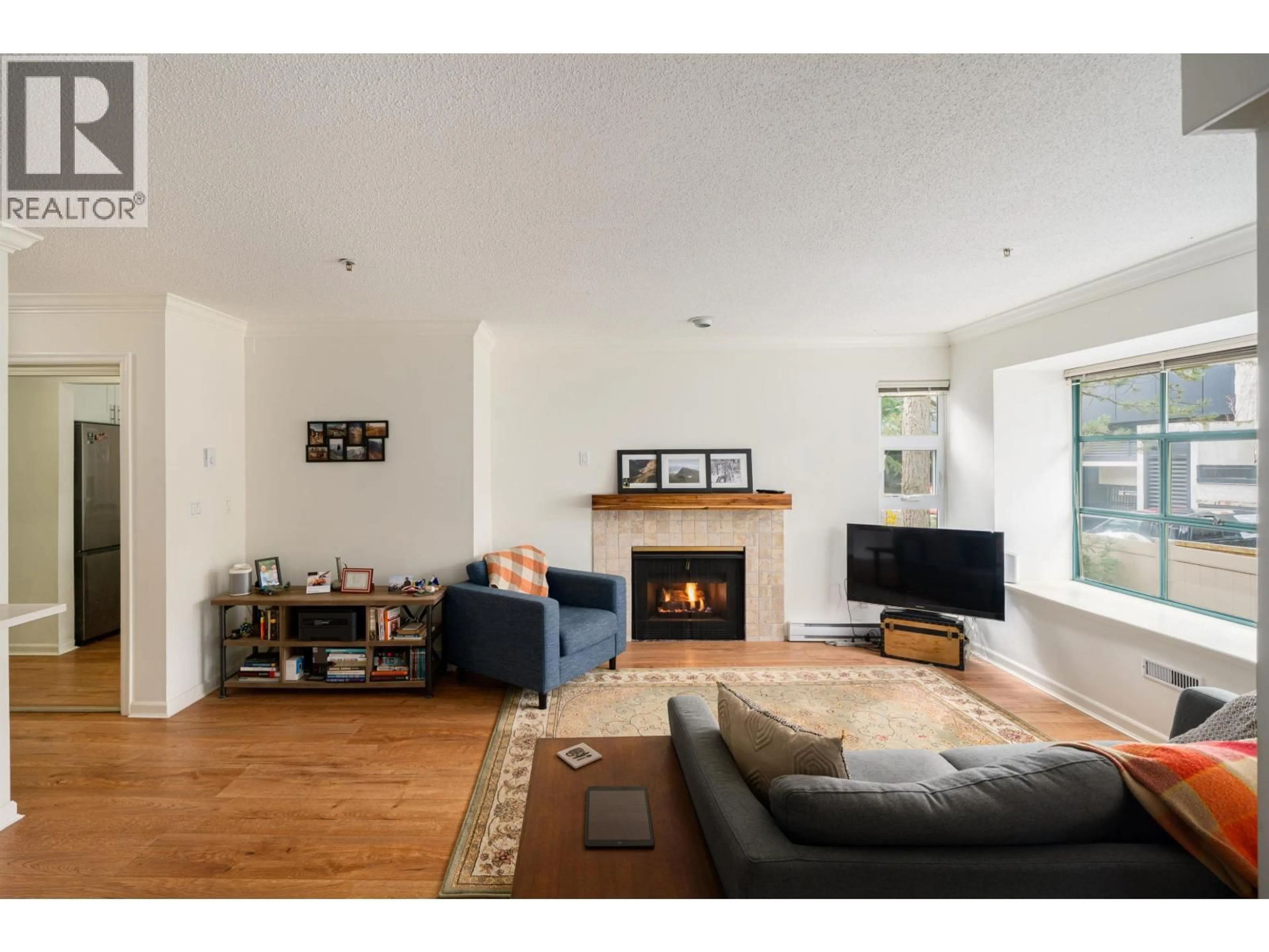 Living room with furniture, wood/laminate floor for 205 - 3788 8TH AVENUE, Vancouver British Columbia V6R1Z3
