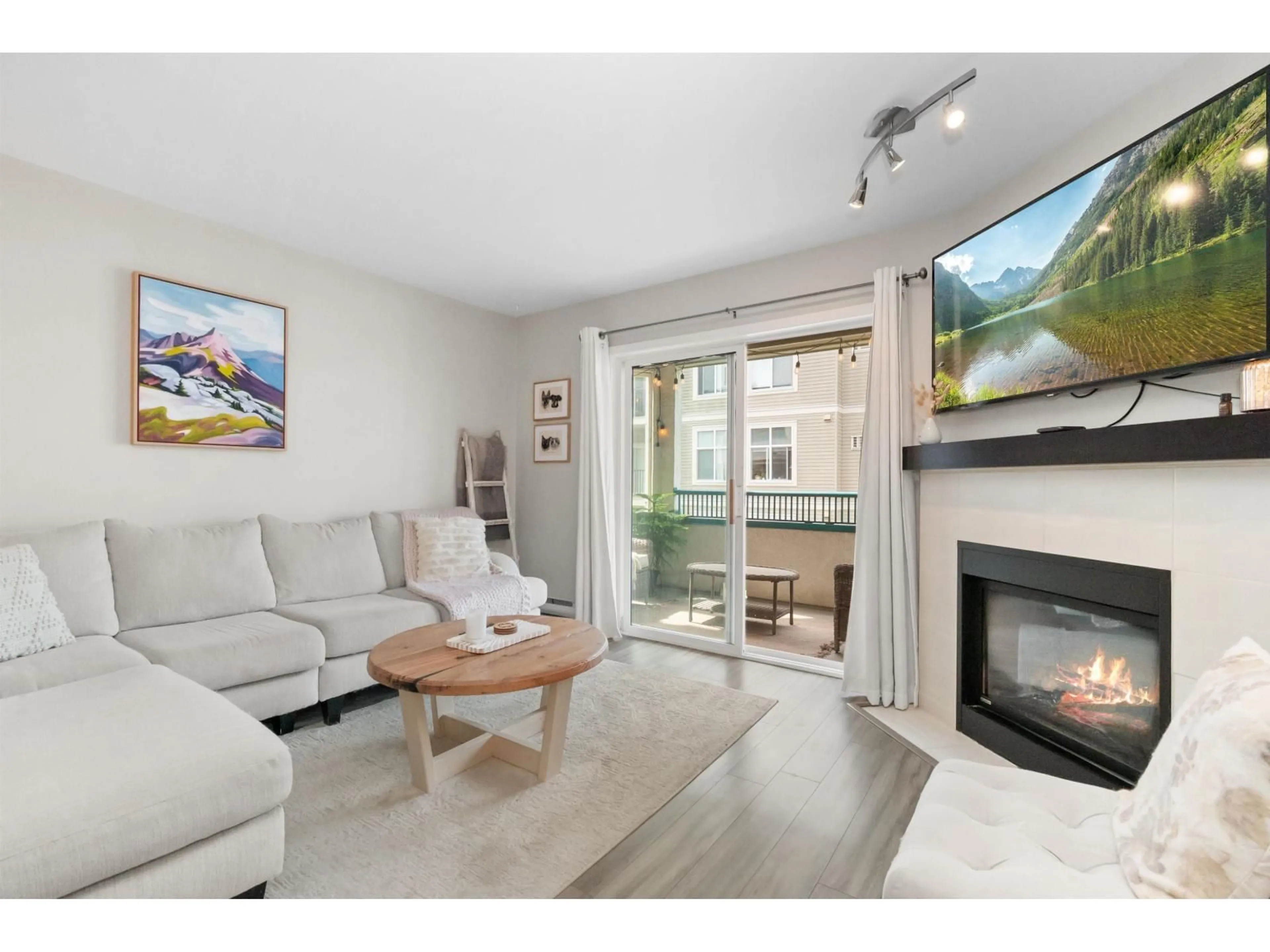 Living room with furniture, wood/laminate floor for 205 - 9143 EDWARD STREET, Chilliwack British Columbia V2P4C5