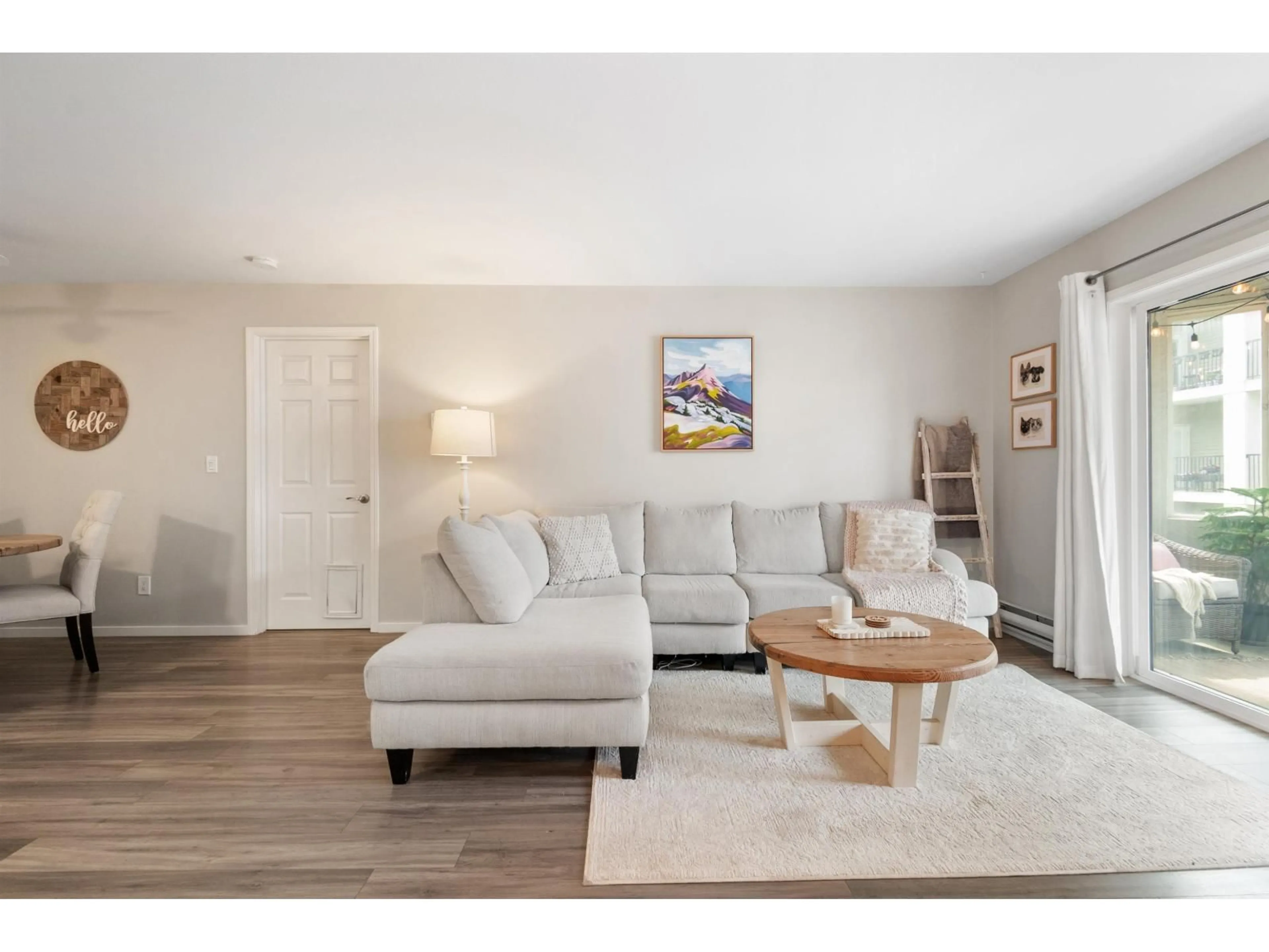 Living room with furniture, wood/laminate floor for 205 - 9143 EDWARD STREET, Chilliwack British Columbia V2P4C5