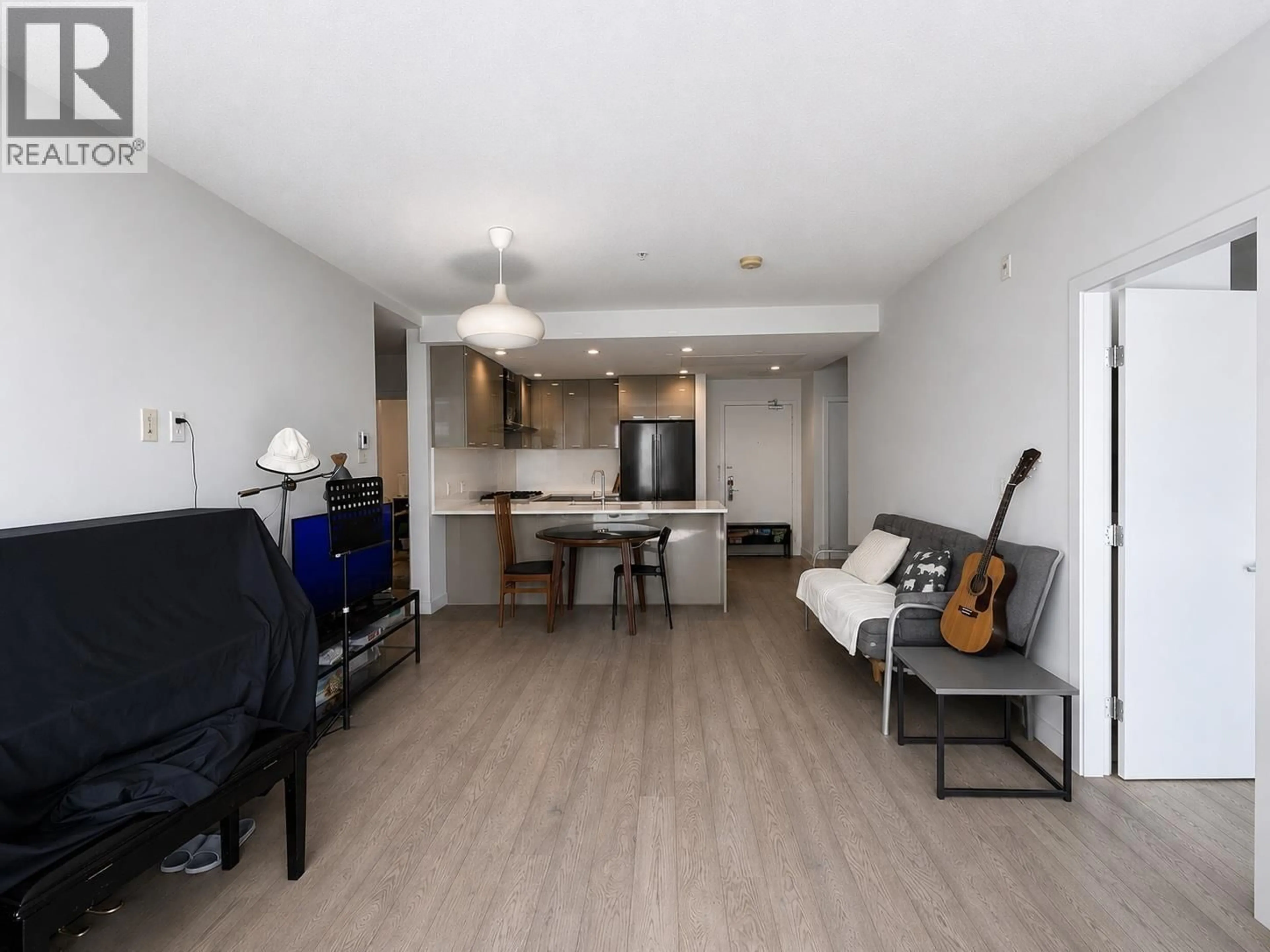 Living room with furniture, wood/laminate floor for 417 - 3581 ROSS DRIVE, Vancouver British Columbia V6S0K5