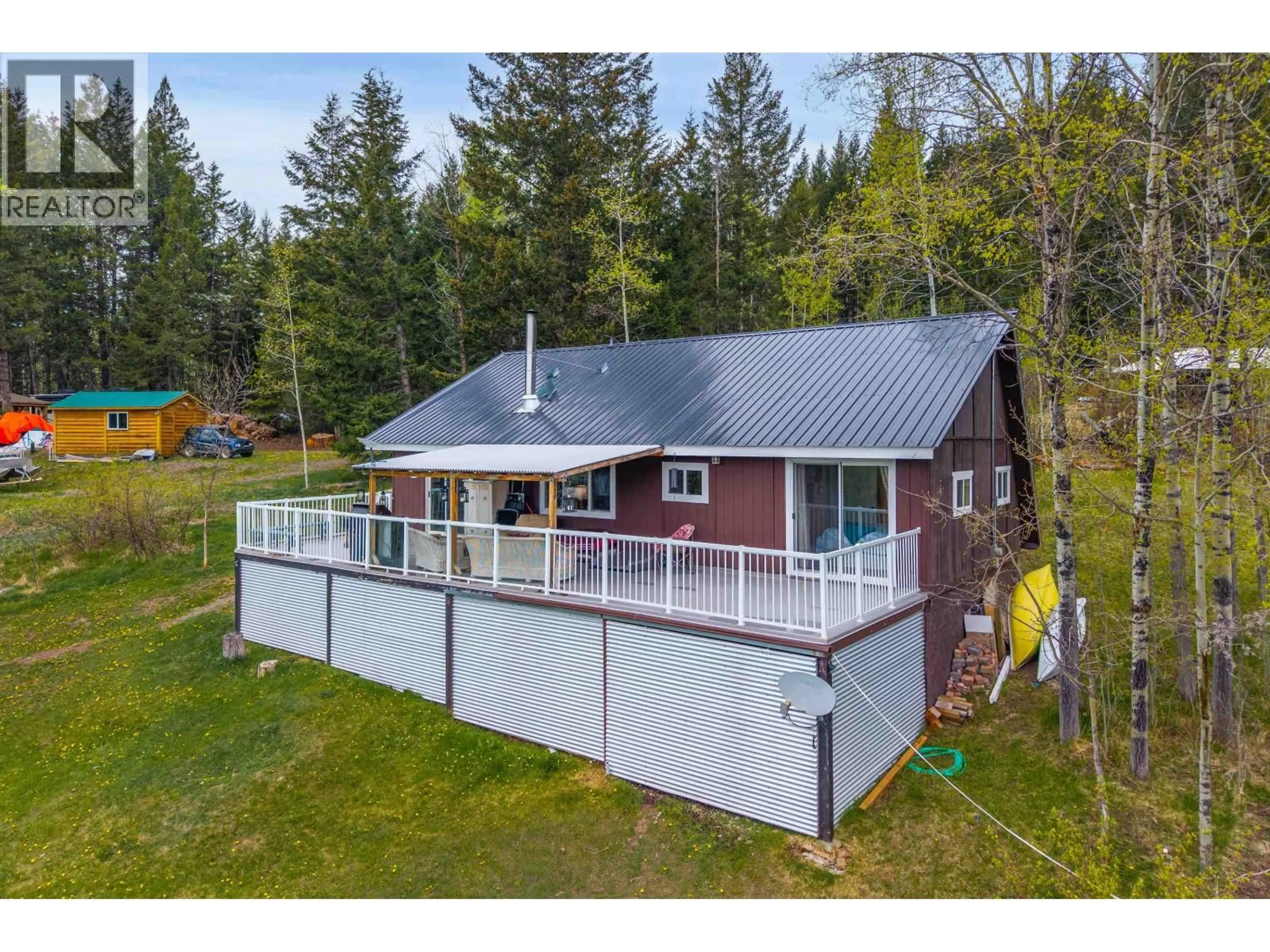 A pic from outside/outdoor area/front of a property/back of a property/a pic from drone, water/lake/river/ocean view for 7796 BRIDGE LAKE ROAD, Bridge Lake British Columbia V0K1X2