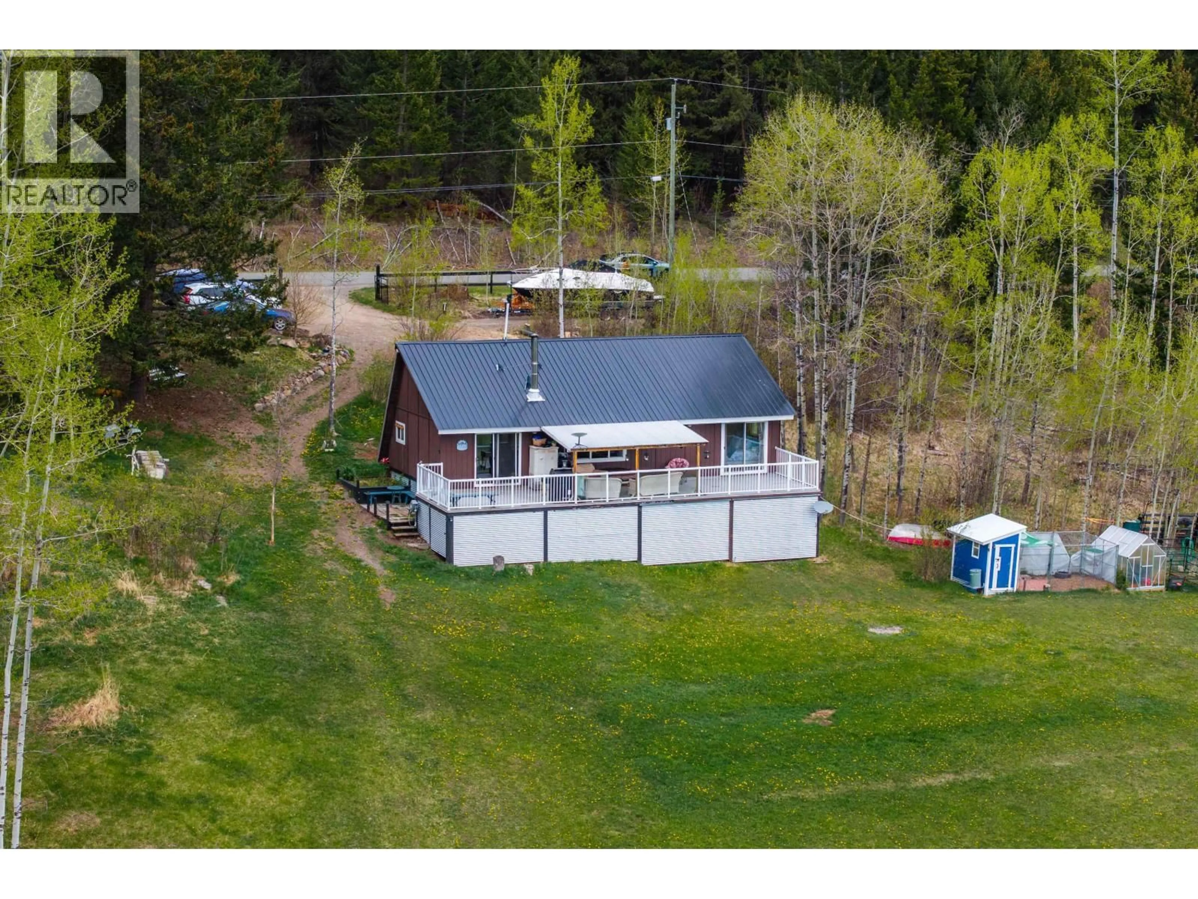 A pic from outside/outdoor area/front of a property/back of a property/a pic from drone, water/lake/river/ocean view for 7796 BRIDGE LAKE ROAD, Bridge Lake British Columbia V0K1X2