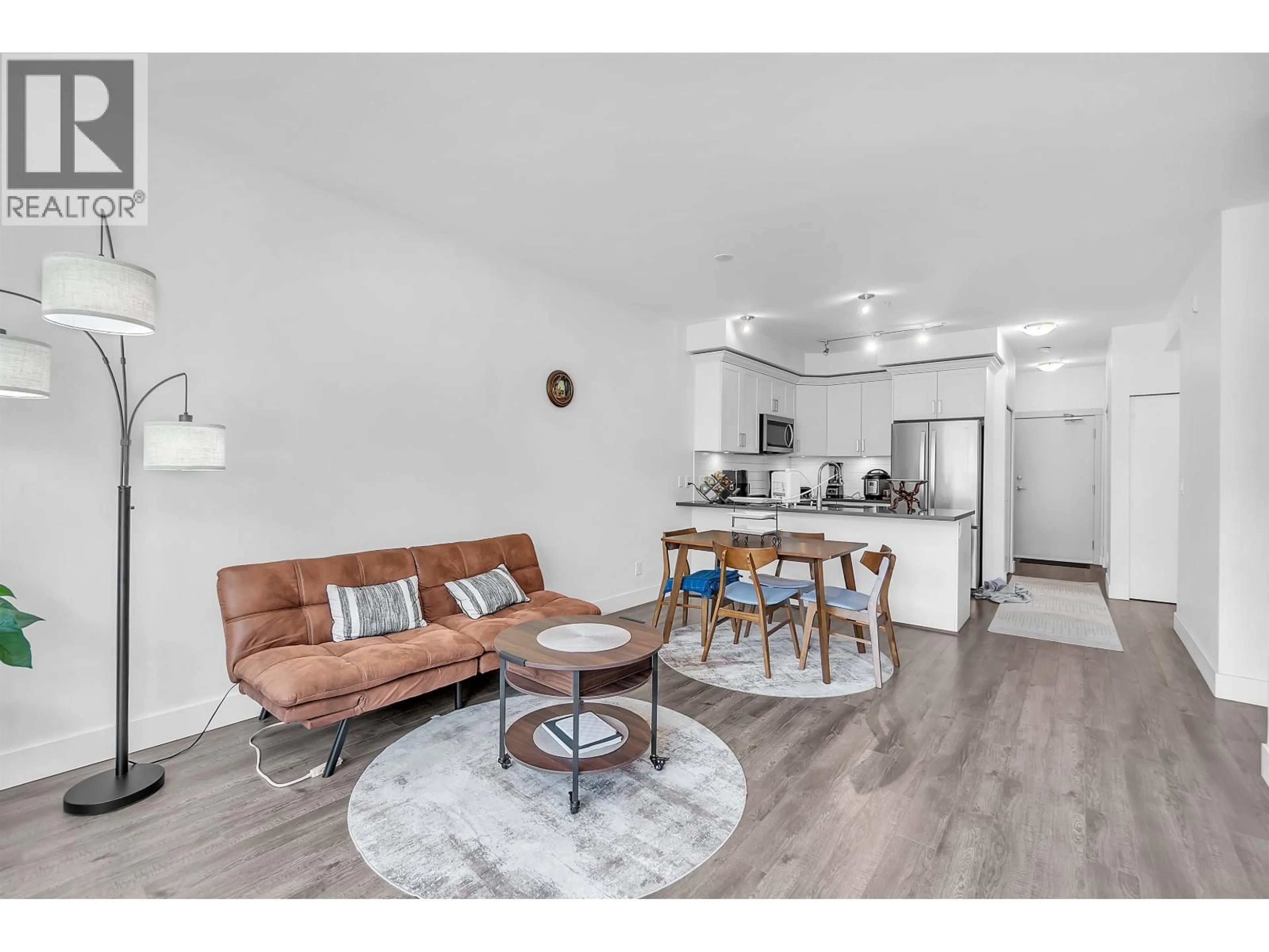 Living room with furniture, wood/laminate floor for 216 - 2436 KELLY AVENUE, Port Coquitlam British Columbia V3C1Y4