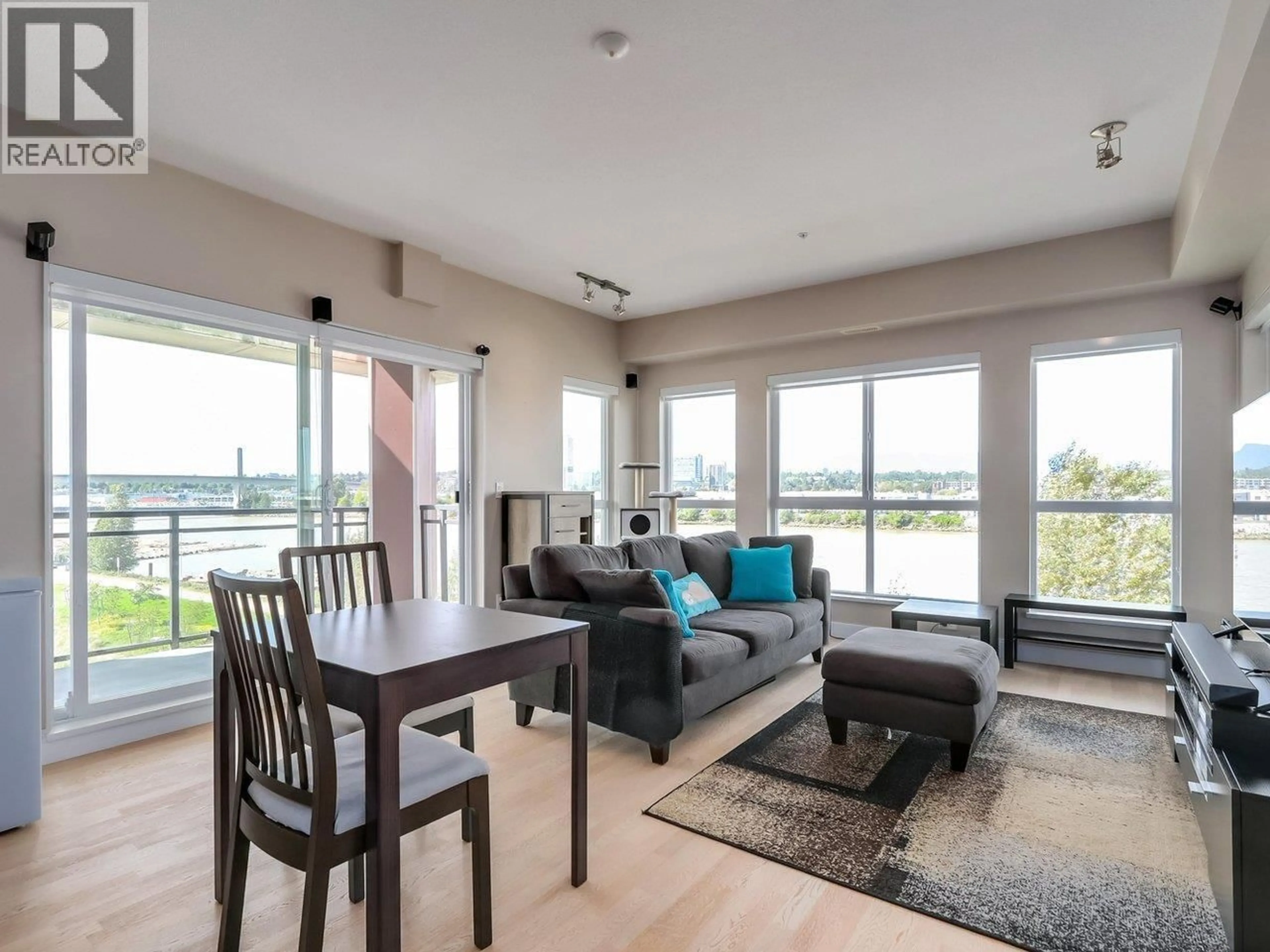 Living room with furniture, wood/laminate floor for 511 - 10033 RIVER DRIVE, Richmond British Columbia V6X0L1