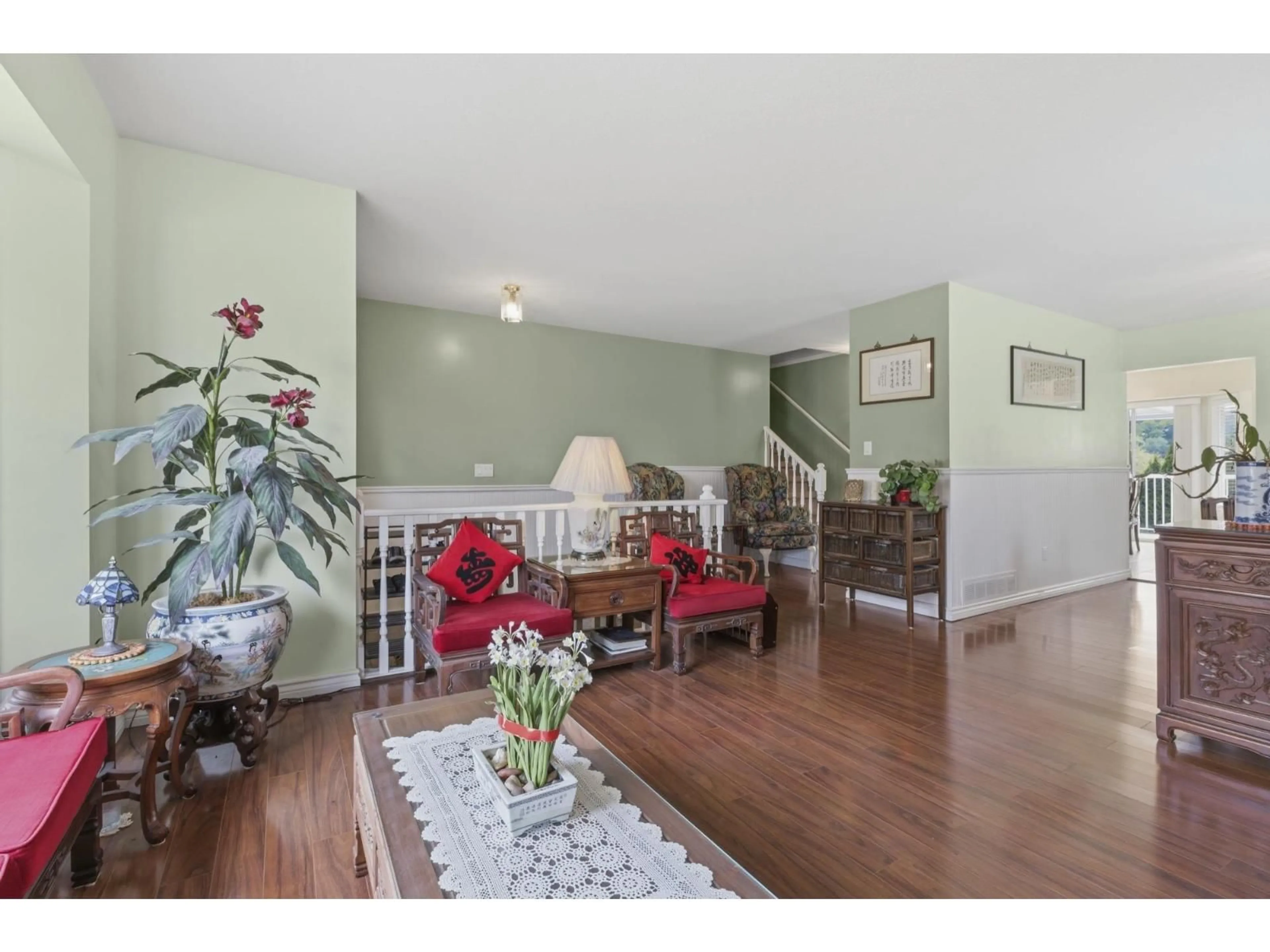 Living room with furniture, wood/laminate floor for 35016 CASSIAR AVENUE, Abbotsford British Columbia V5S5S9