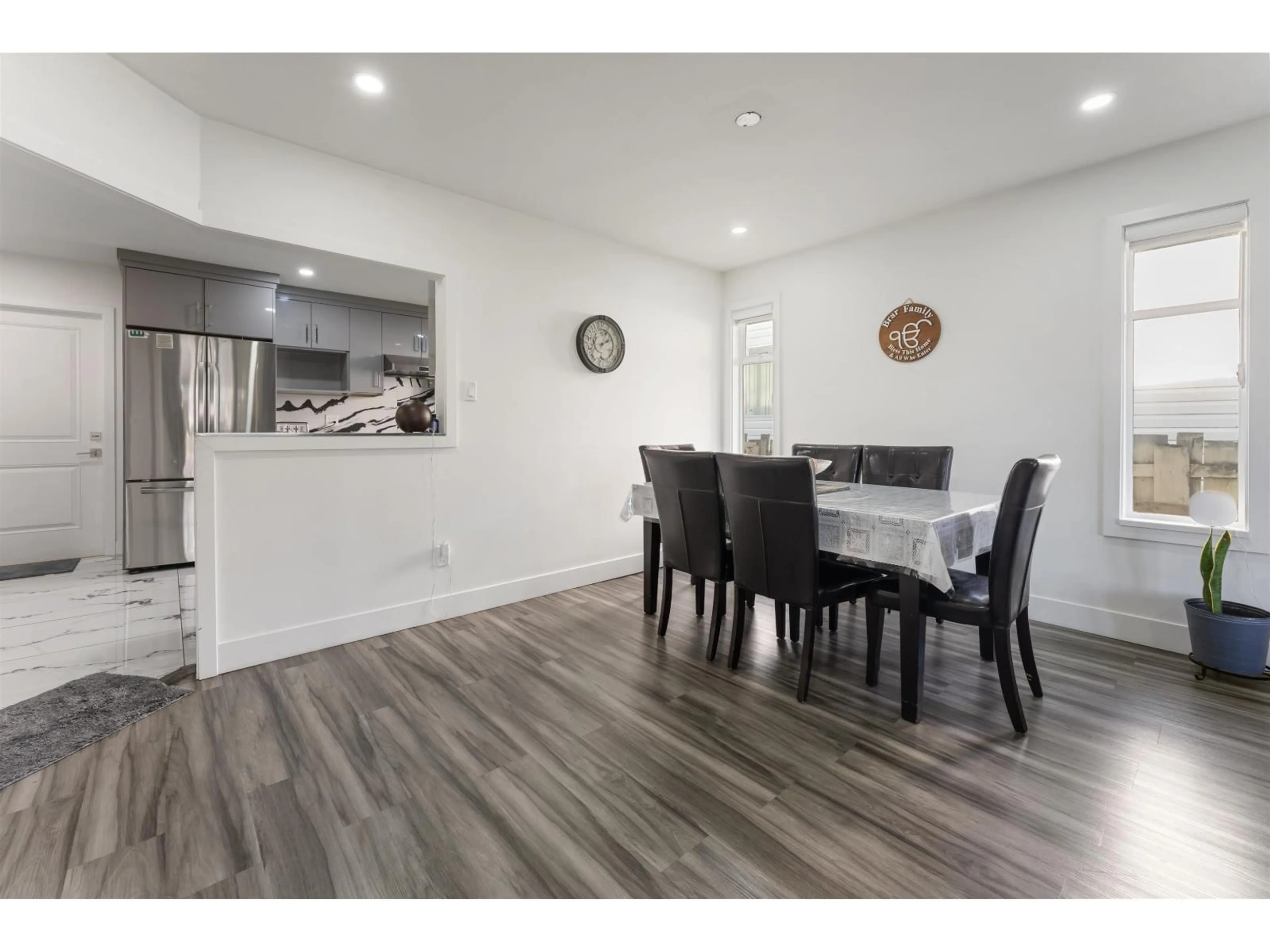 Open concept kitchen, wood/laminate floor for 7309 123 STREET, Surrey British Columbia V3W9J2