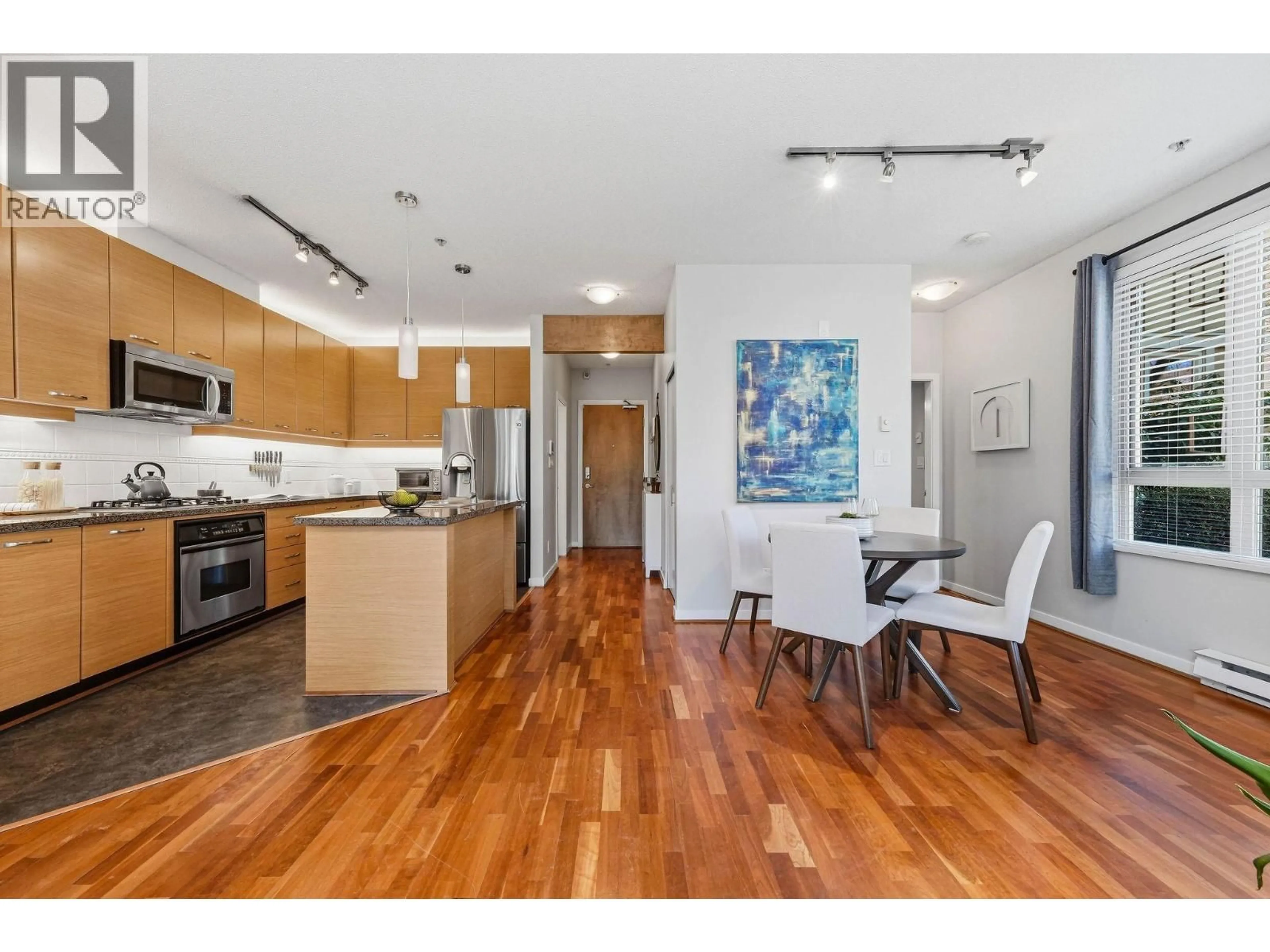 Open concept kitchen, wood/laminate floor for 223 - 530 RAVEN WOODS DRIVE, North Vancouver British Columbia V7G2T5