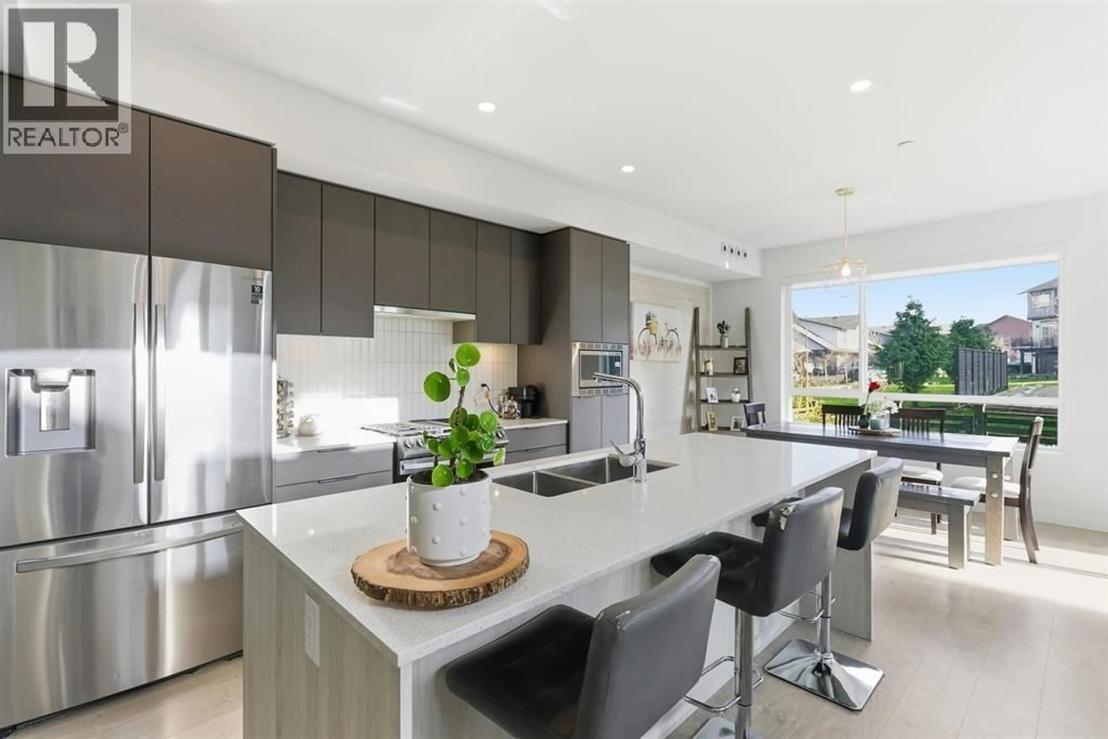 Open concept kitchen, ceramic/tile floor for 2478A WREN DRIVE, Delta British Columbia V4M0E6