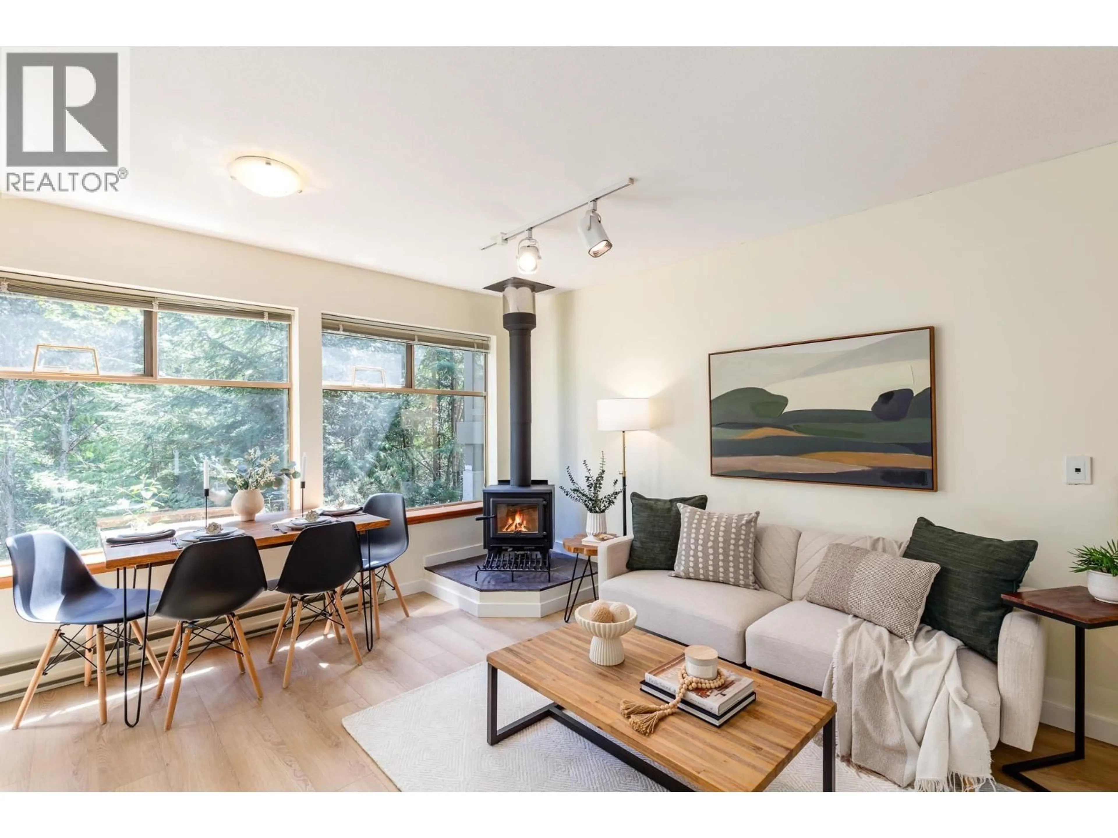 Living room with furniture, wood/laminate floor for 301 - 3050 HILLCREST DRIVE, Whistler British Columbia V8E0T8