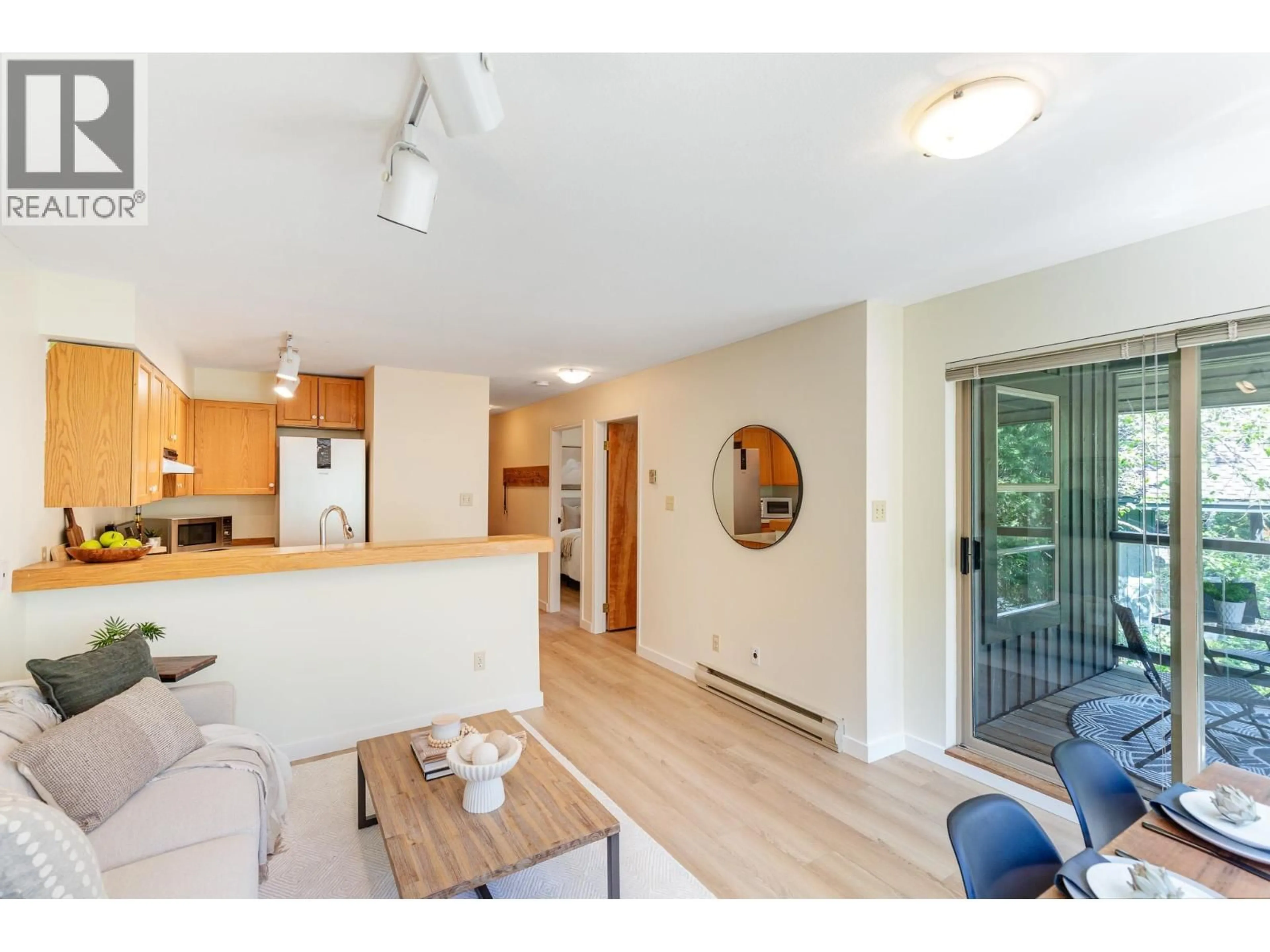 Open concept kitchen, wood/laminate floor for 301 - 3050 HILLCREST DRIVE, Whistler British Columbia V8E0T8