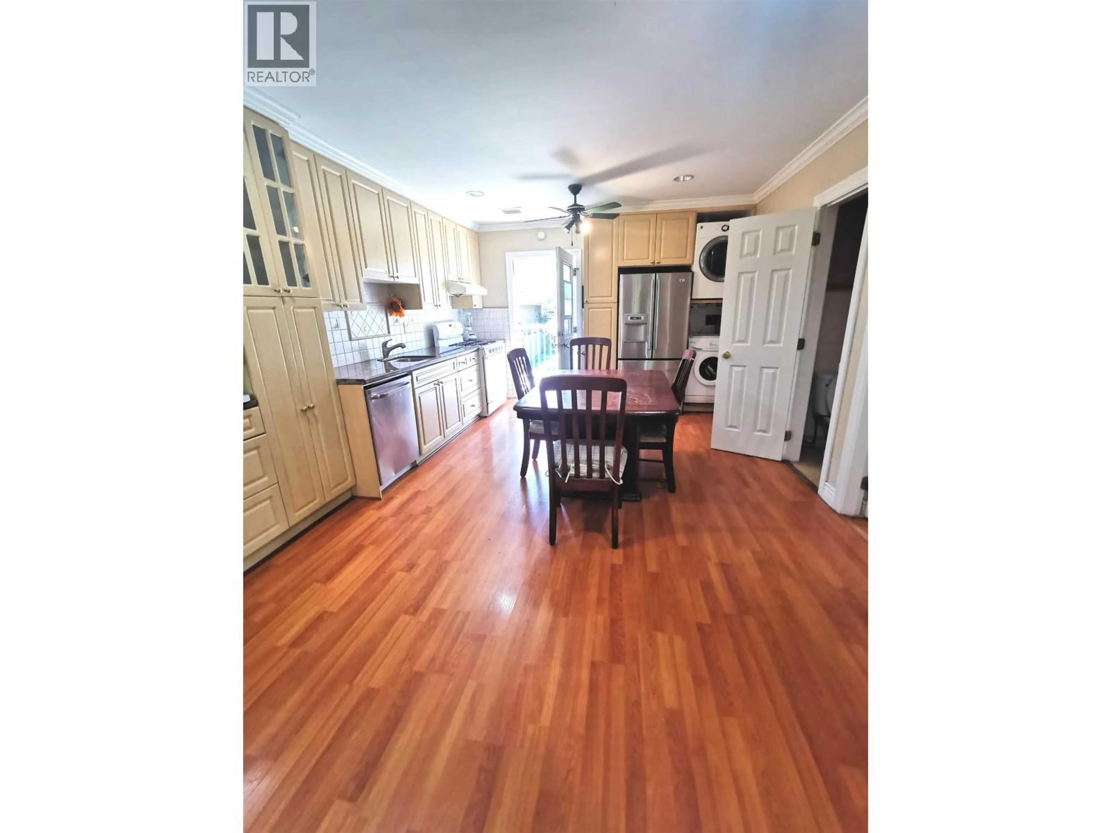 Open concept kitchen, wood/laminate floor for 8067 FRENCH STREET, Vancouver British Columbia V6P4V9