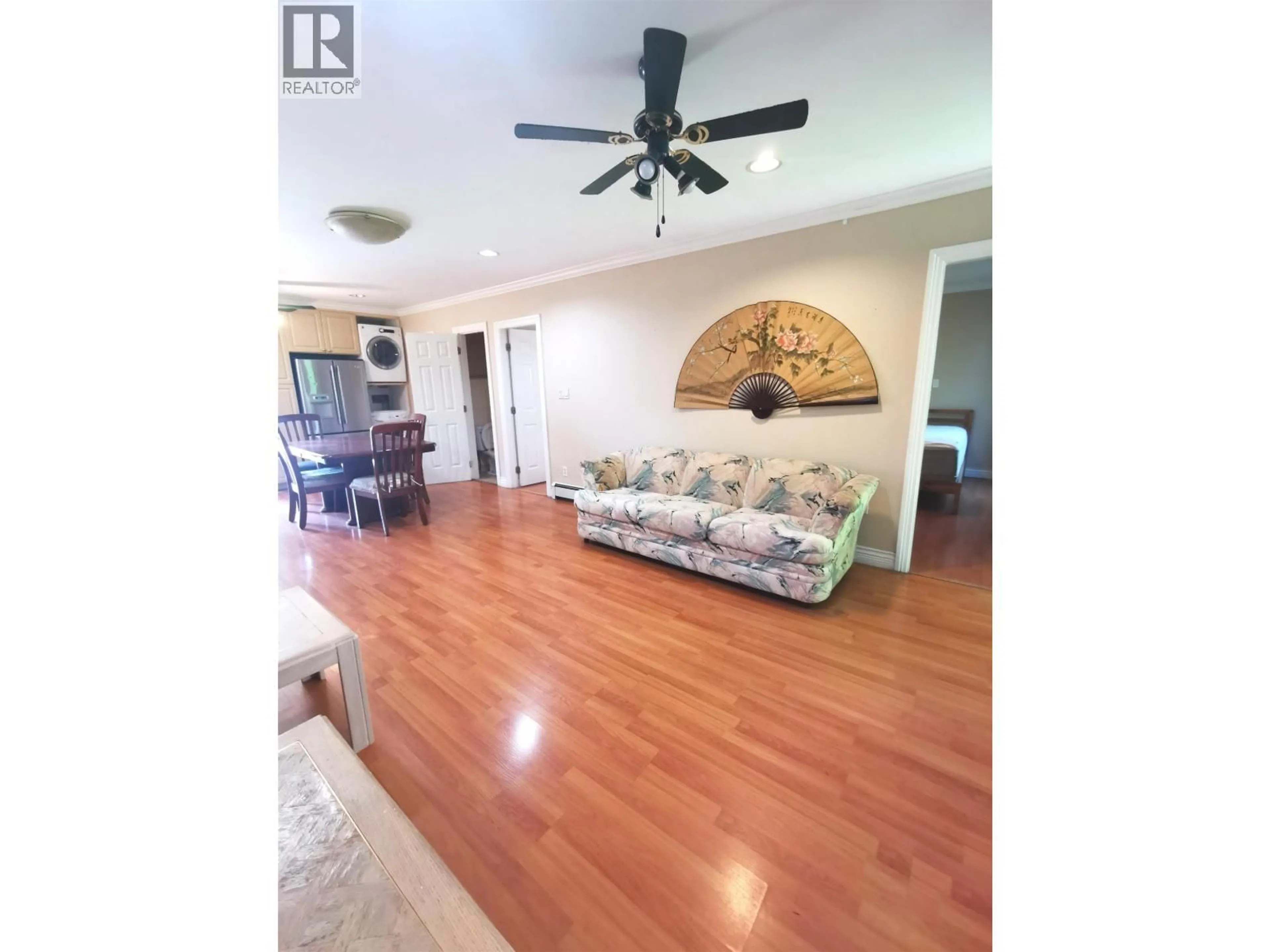 Living room with furniture, wood/laminate floor for 8067 FRENCH STREET, Vancouver British Columbia V6P4V9