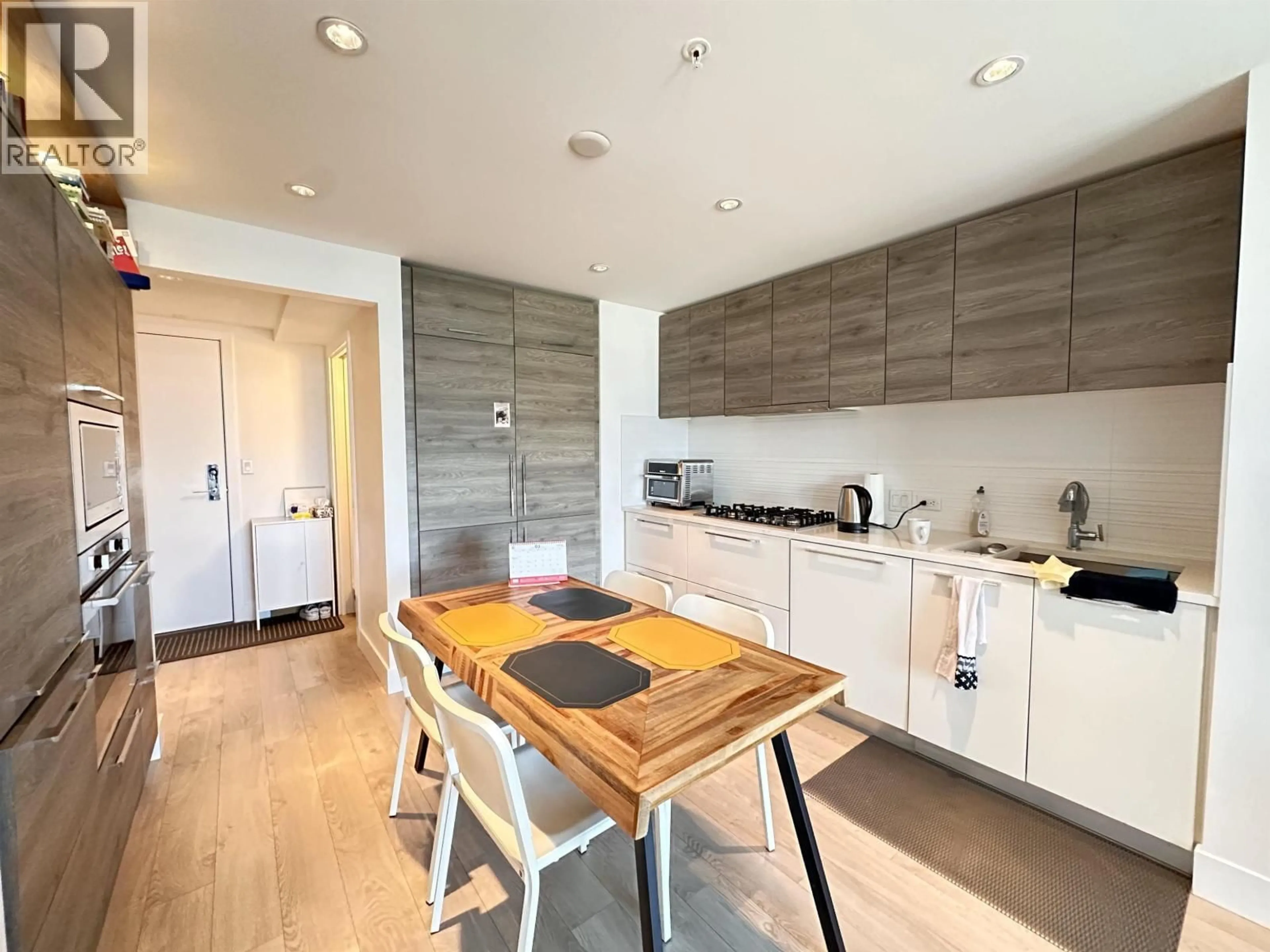 Open concept kitchen, wood/laminate floor for 703 - 7303 NOBLE LANE, Burnaby British Columbia V3N0H2