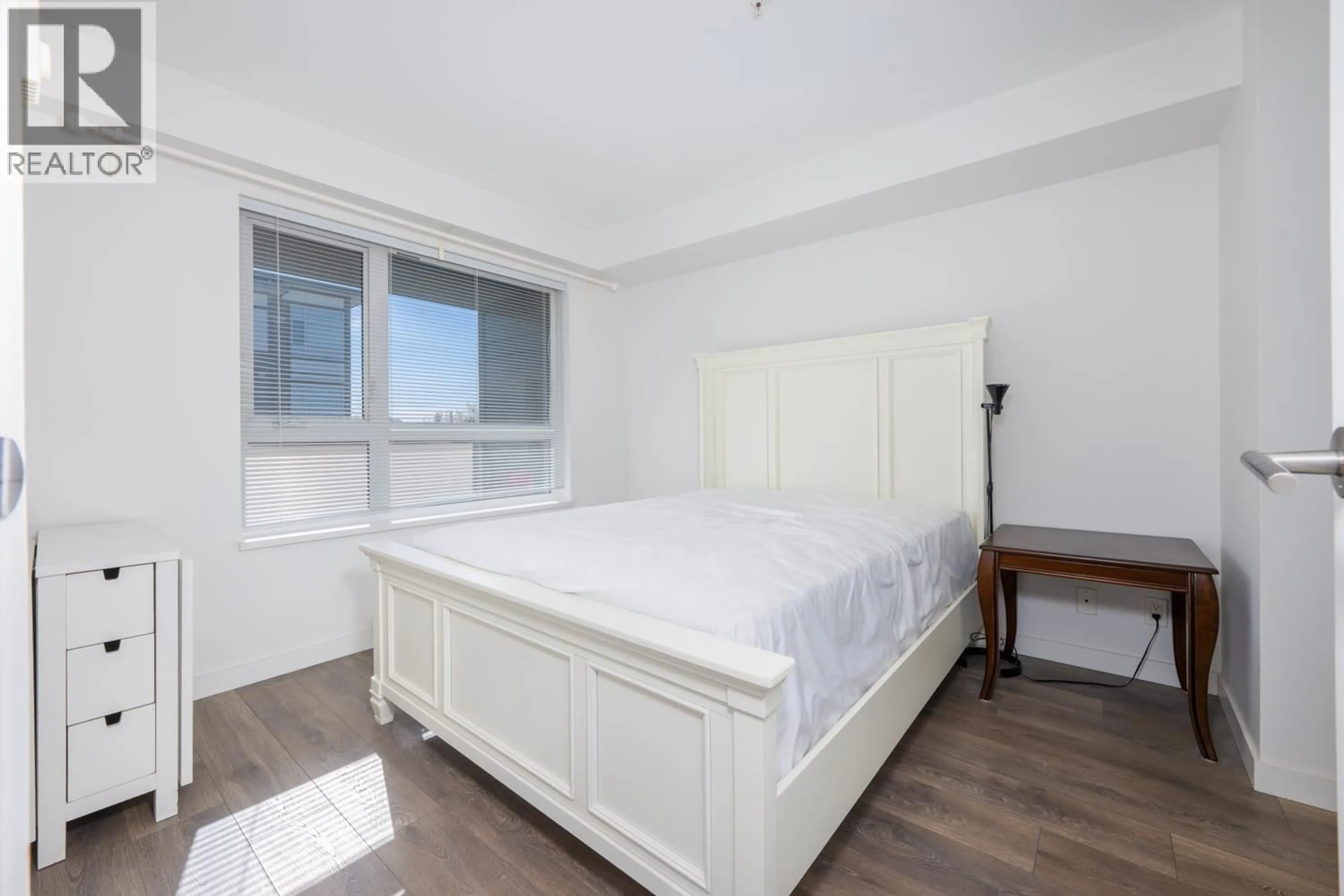 Bedroom with bed, wood/laminate floor for 313 - 10880 NO. 5 ROAD, Richmond British Columbia V6W0B3
