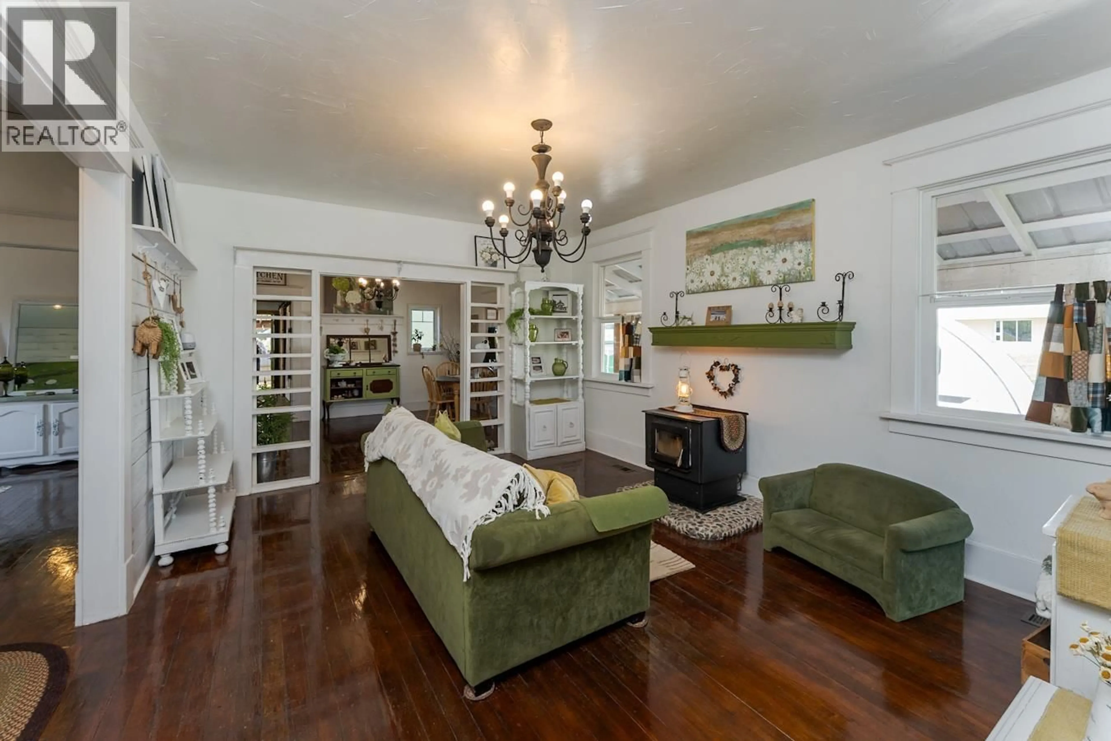 Living room with furniture, wood/laminate floor for 1787 7TH AVENUE, Prince George British Columbia V2L3P7