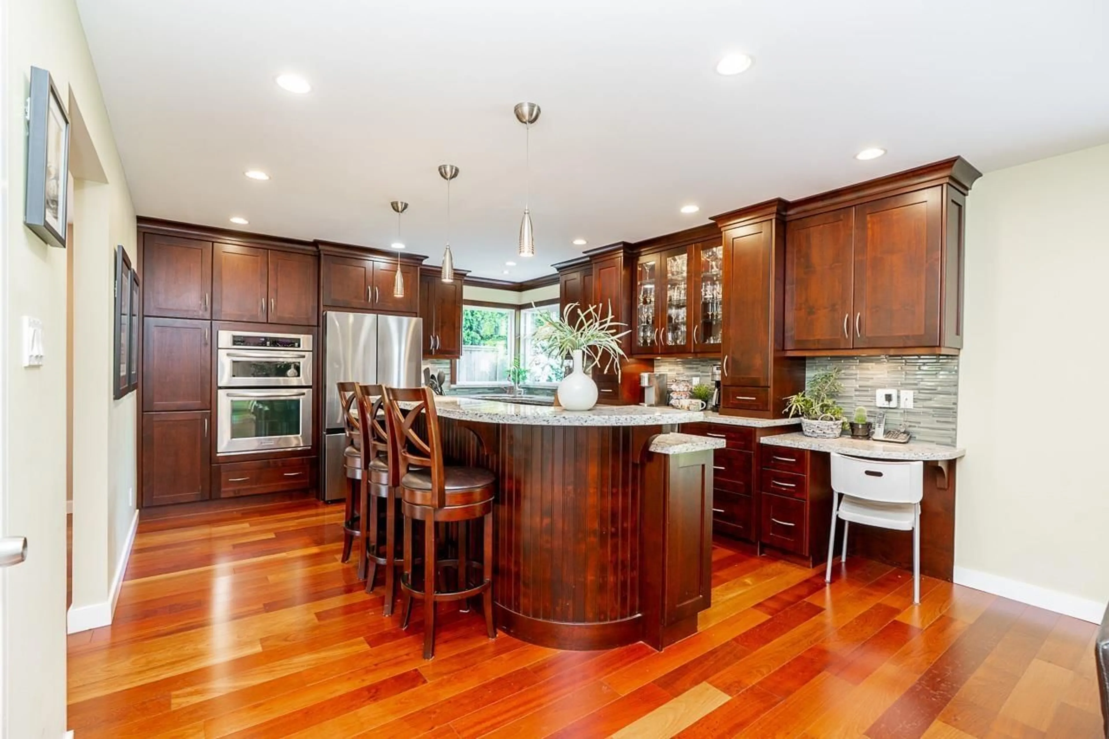 Open concept kitchen, wood/laminate floor for 7762 STAMFORD PLACE, Delta British Columbia V4C7T5