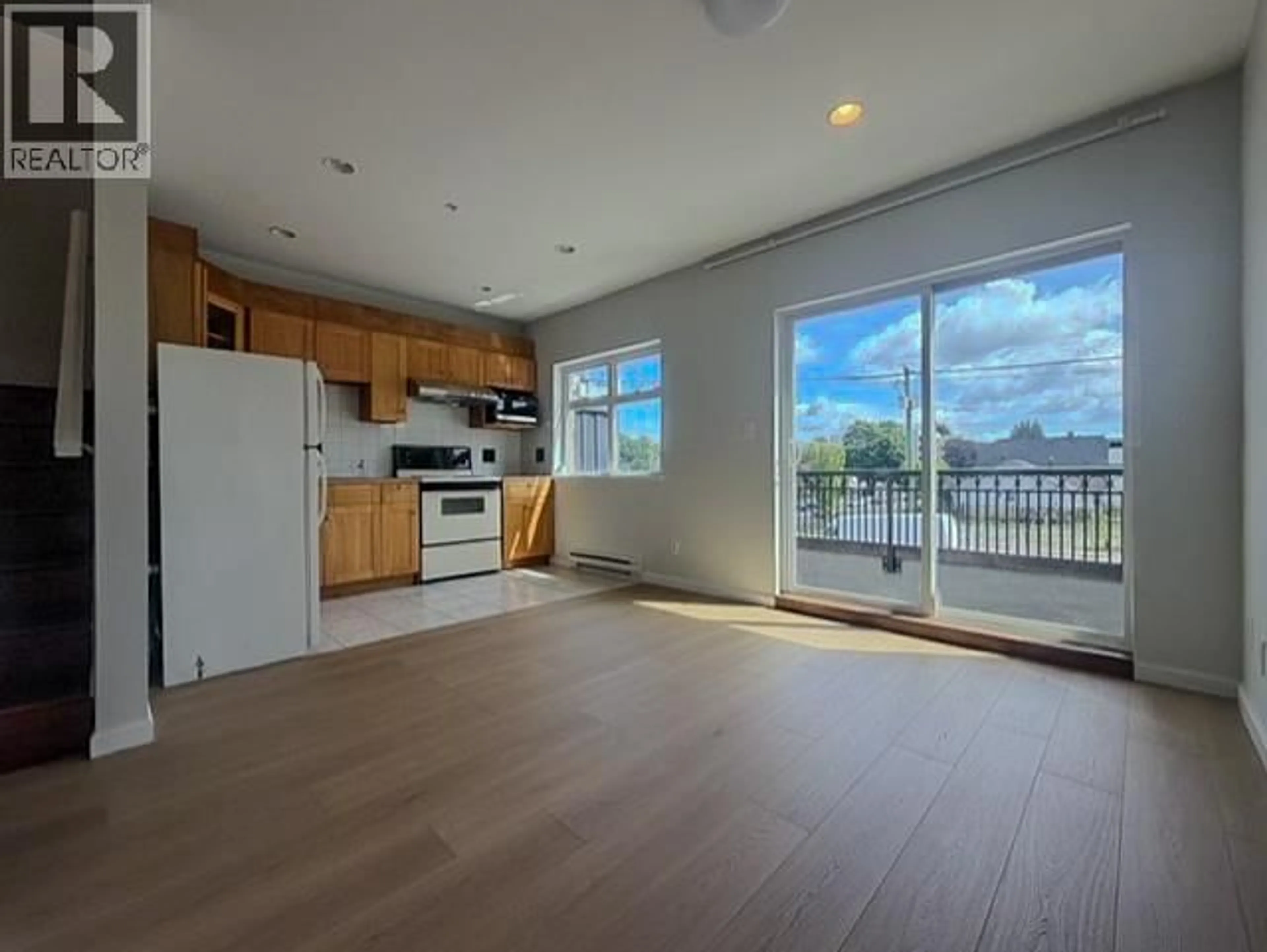 Open concept kitchen, wood/laminate floor for 203 - 2817 CLARK DRIVE, Vancouver British Columbia V5N3H7