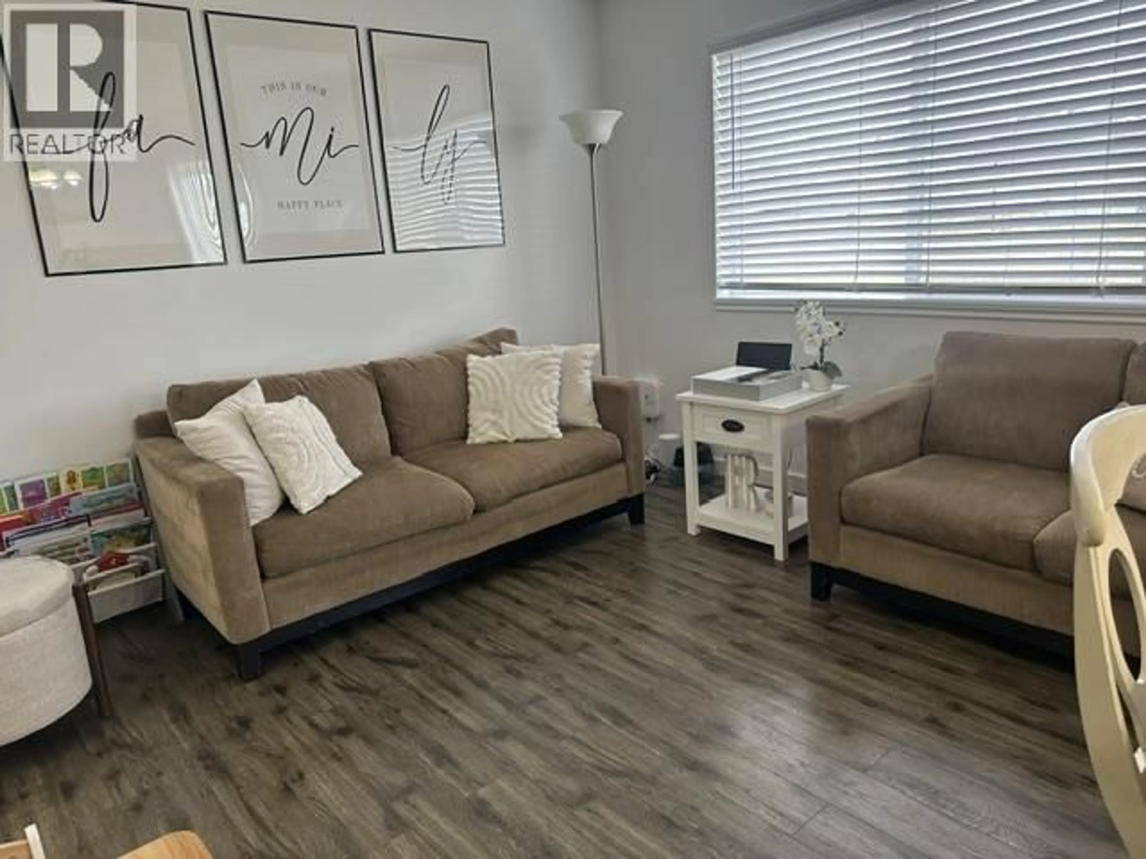 Living room with furniture, wood/laminate floor for 306 - 9019 86 STREET, Fort St. John British Columbia V1J6X4