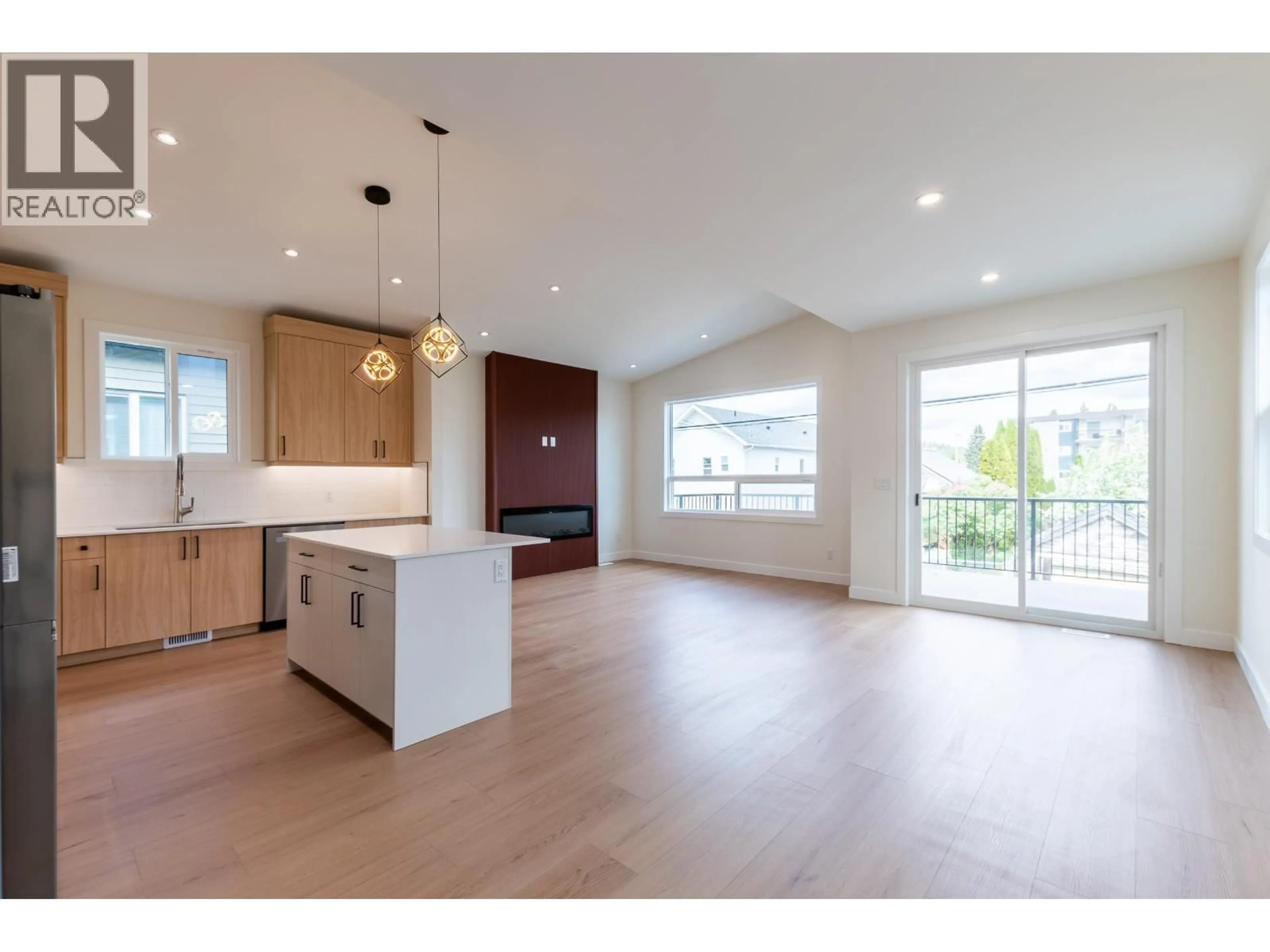 Open concept kitchen, wood/laminate floor for 1660 11TH AVENUE, Prince George British Columbia V2L3S8