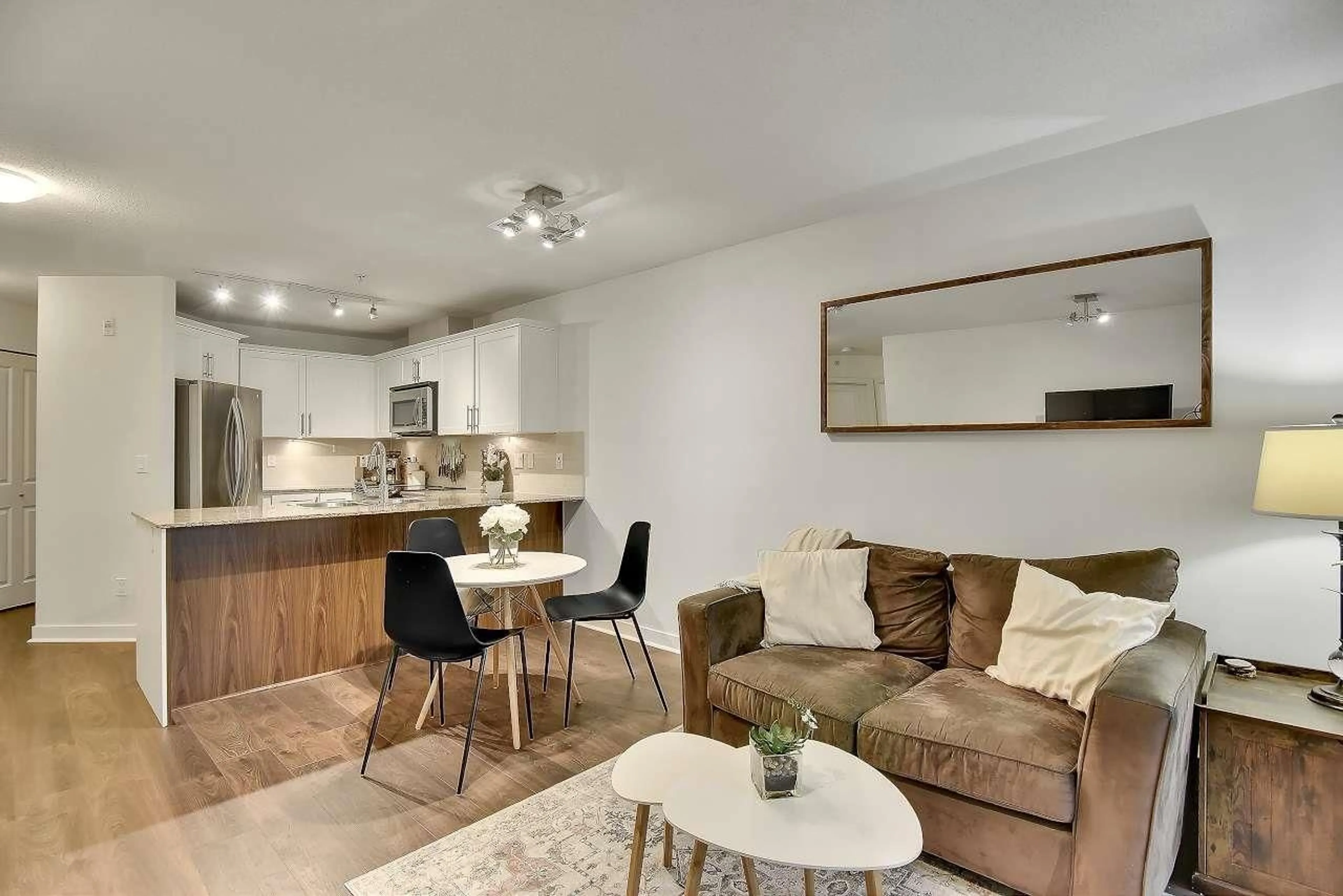 Living room with furniture, wood/laminate floor for 402 - 8915 202 STREET, Langley British Columbia V1M0B5