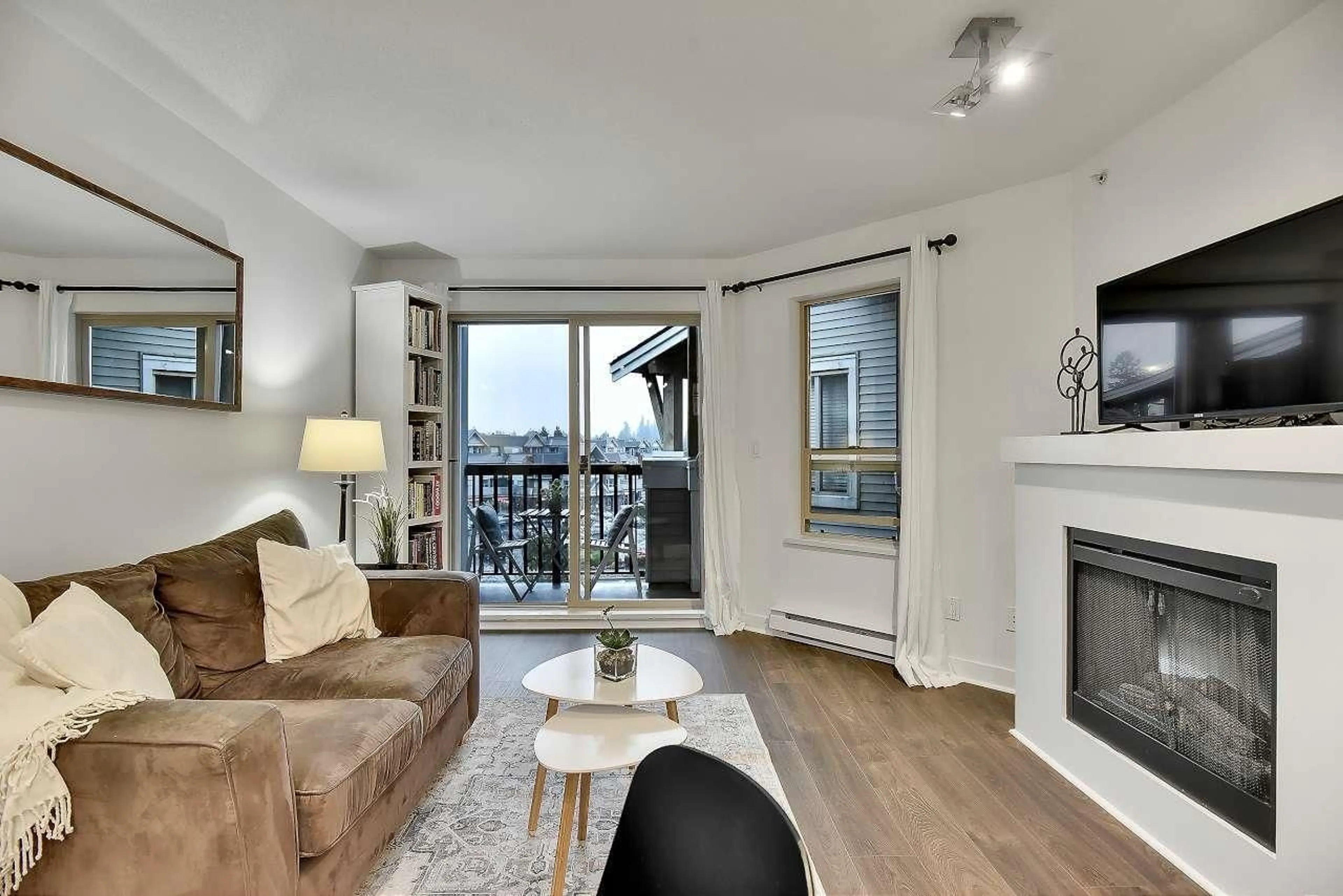 Living room with furniture, wood/laminate floor for 402 - 8915 202 STREET, Langley British Columbia V1M0B5