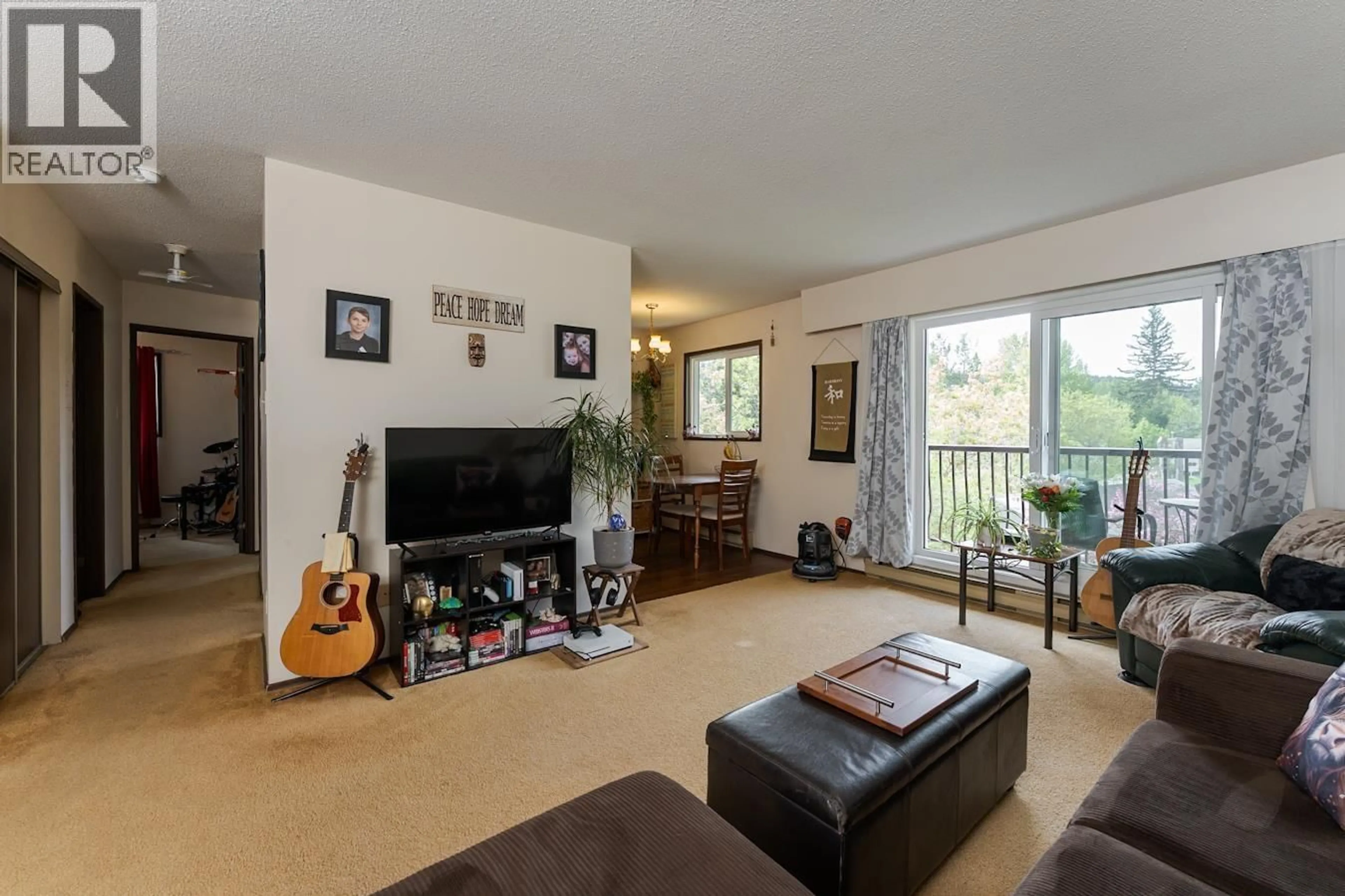 Living room with furniture, wood/laminate floor for 310 - 2217 REGENTS CRESCENT, Prince George British Columbia V2L1E9