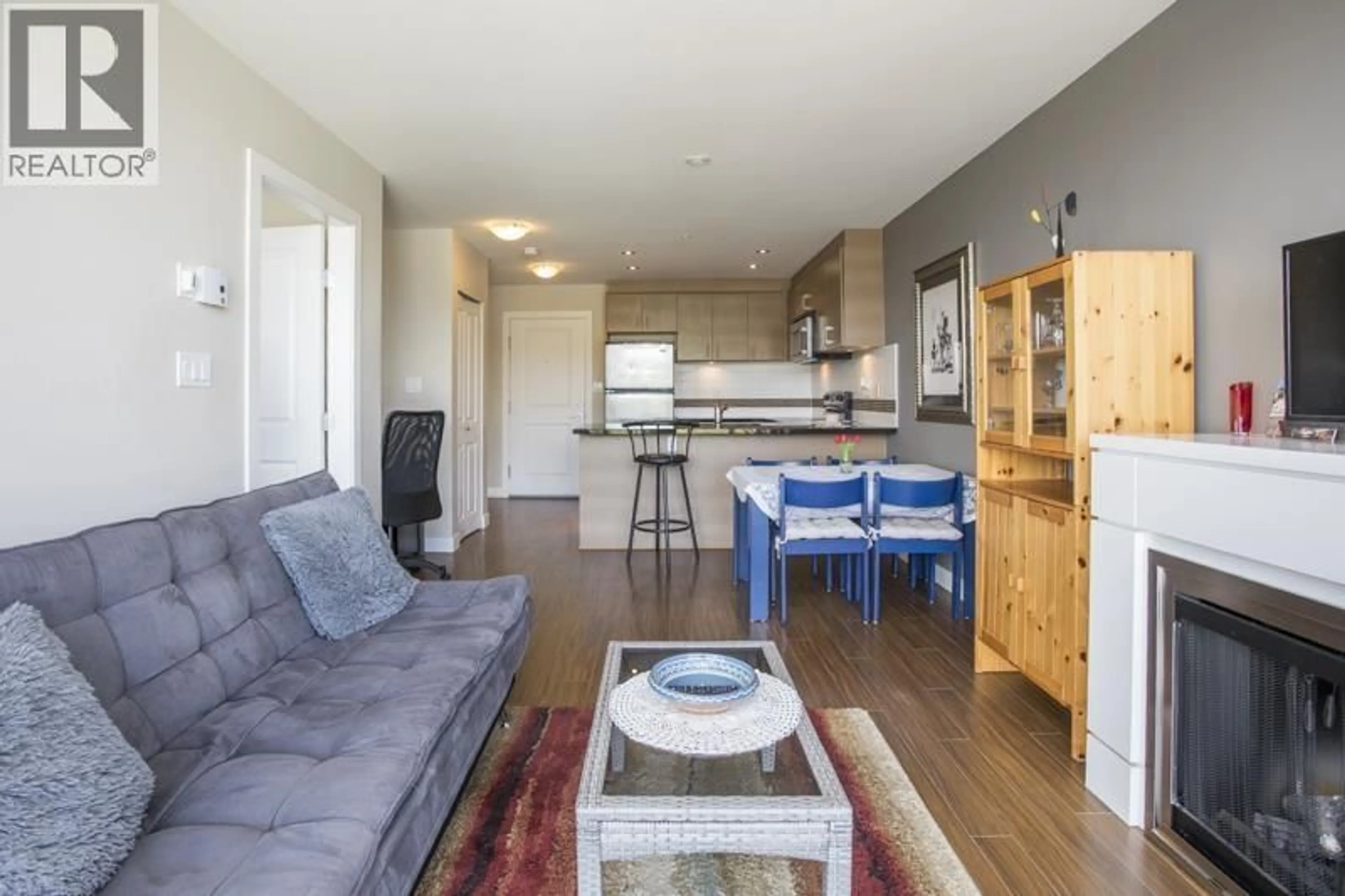 Living room with furniture, wood/laminate floor for 802 - 12069 HARRIS ROAD, Pitt Meadows British Columbia V3Y0C8