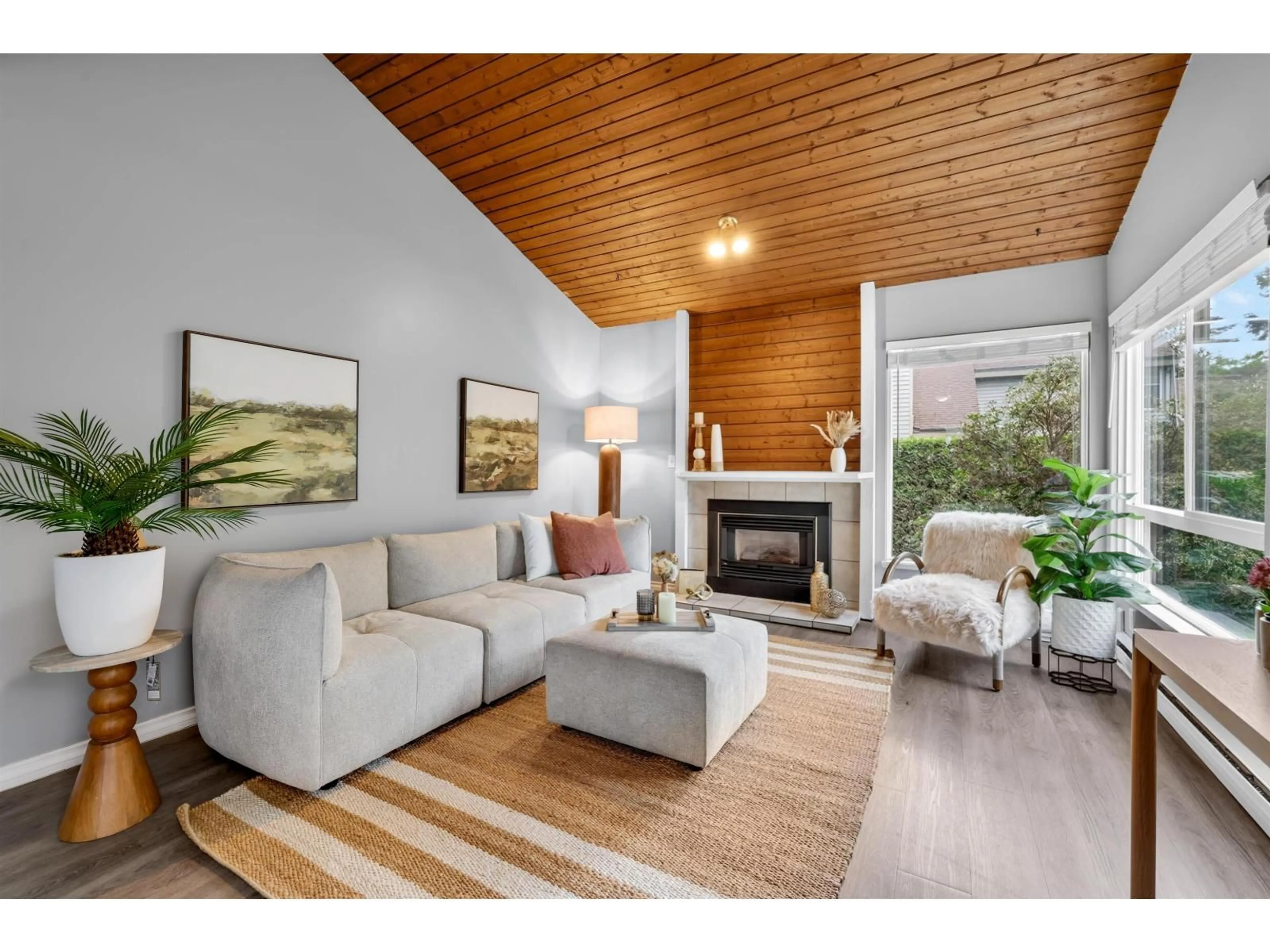 Living room with furniture, wood/laminate floor for 6226 GREENSIDE DRIVE EAST, Surrey British Columbia V3S5M8