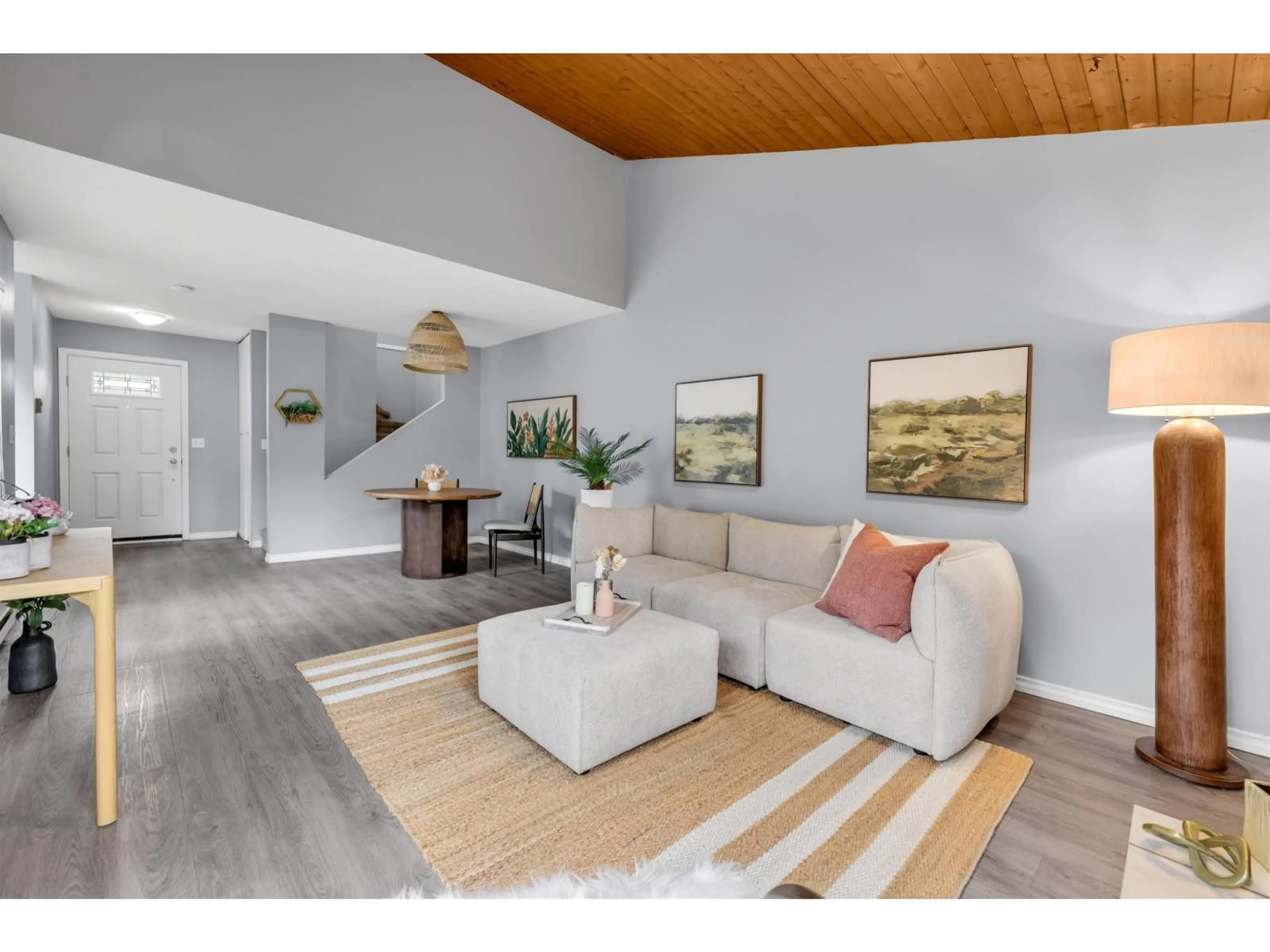 Living room with furniture, wood/laminate floor for 6226 GREENSIDE DRIVE EAST, Surrey British Columbia V3S5M8