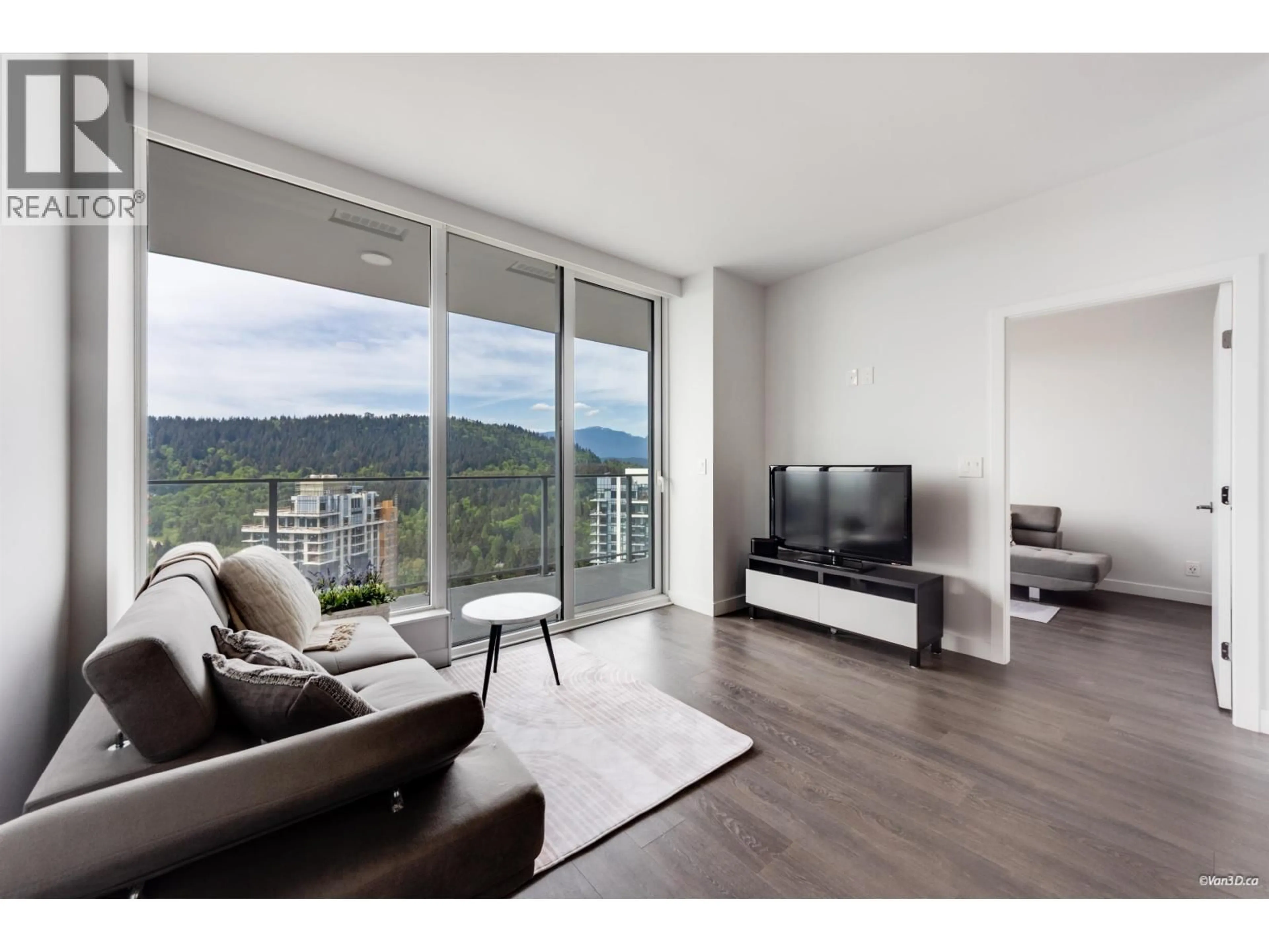 Living room with furniture, wood/laminate floor for 2603 - 567 CLARKE ROAD, Coquitlam British Columbia V3J0K7