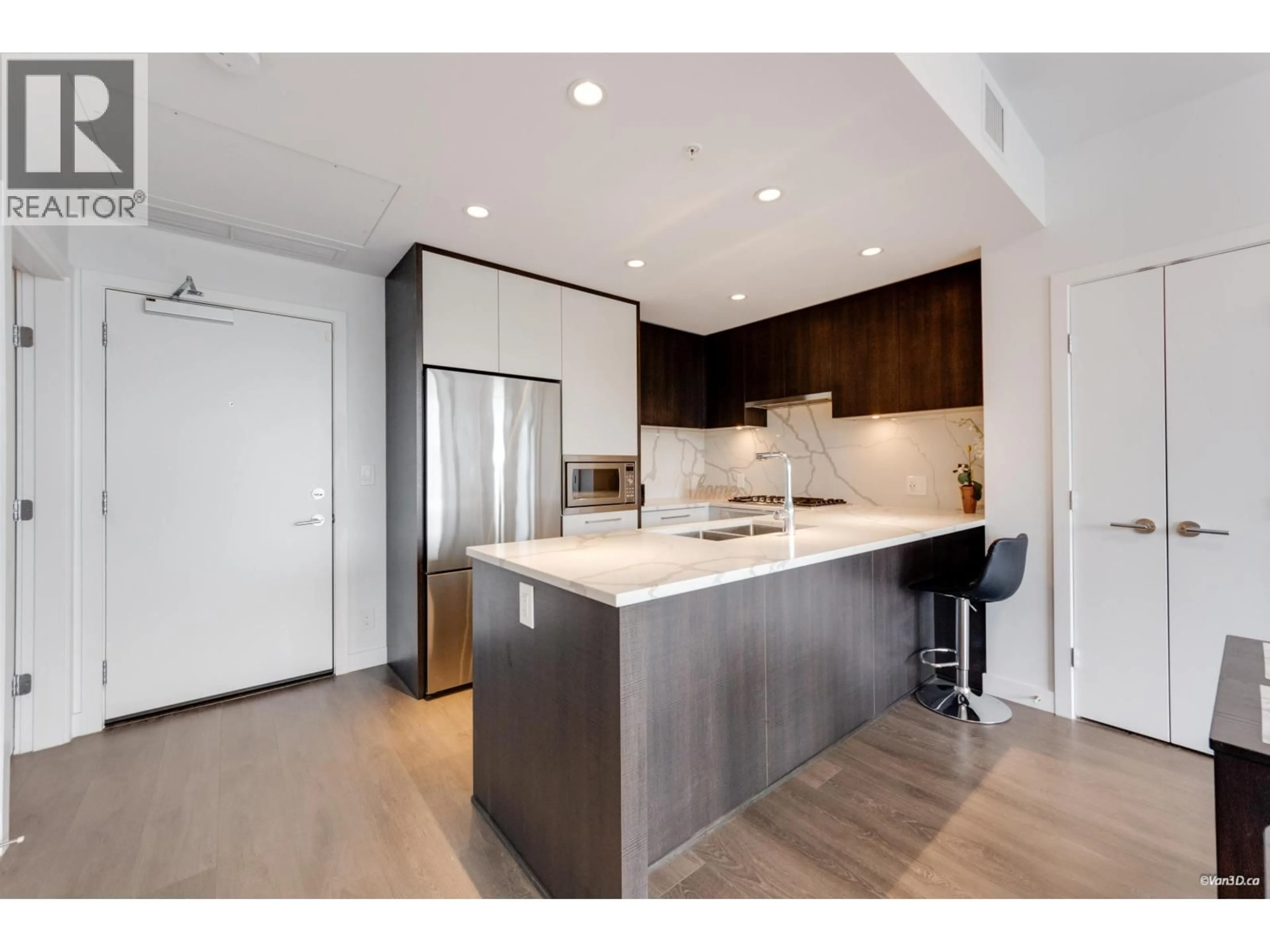 Open concept kitchen, wood/laminate floor for 2603 - 567 CLARKE ROAD, Coquitlam British Columbia V3J0K7